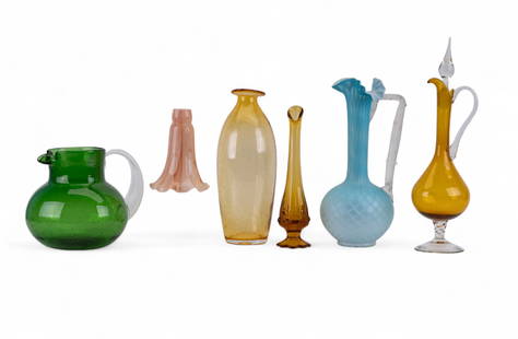 Art Glass Vessels and Lamp Shade: Mixed lot of 7 hand blown art glass items including a pale blue satin glass ewer with diamond optic pattern, ruffled rim, and frosted applied handle. Tall amber bubble glass bottle vase, a green crack
