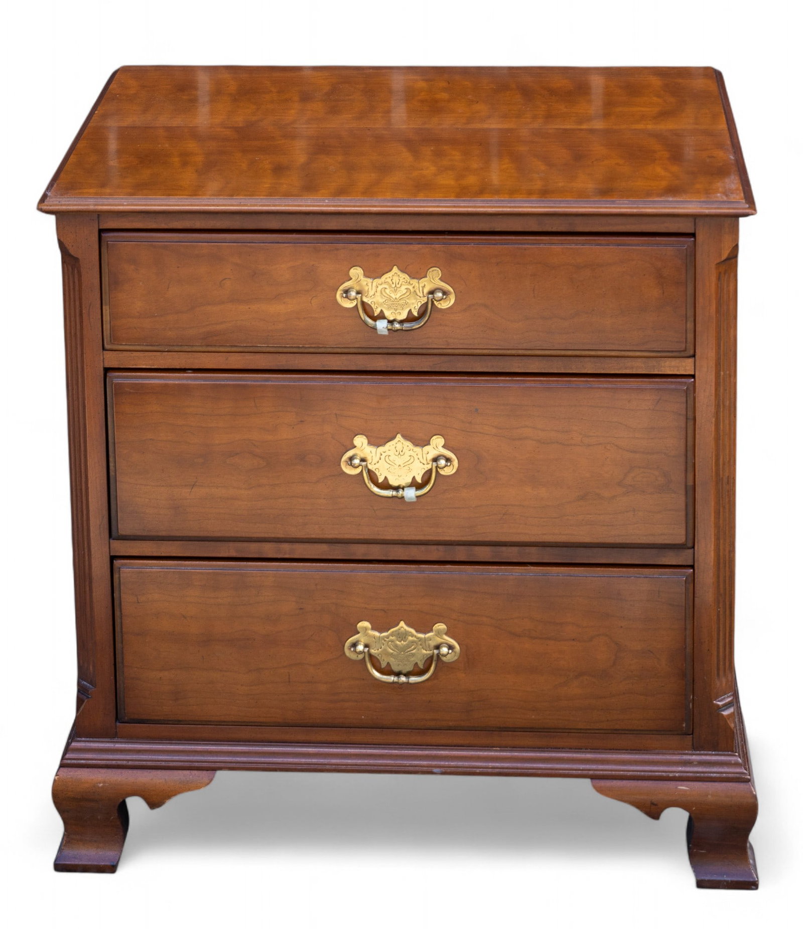 Kindel 3-Drawer Stand: A Kindel 3-drawer stand in Chippendale style with ornate brass pulls. Measures approx. 26" H x 25" W x 18" D.