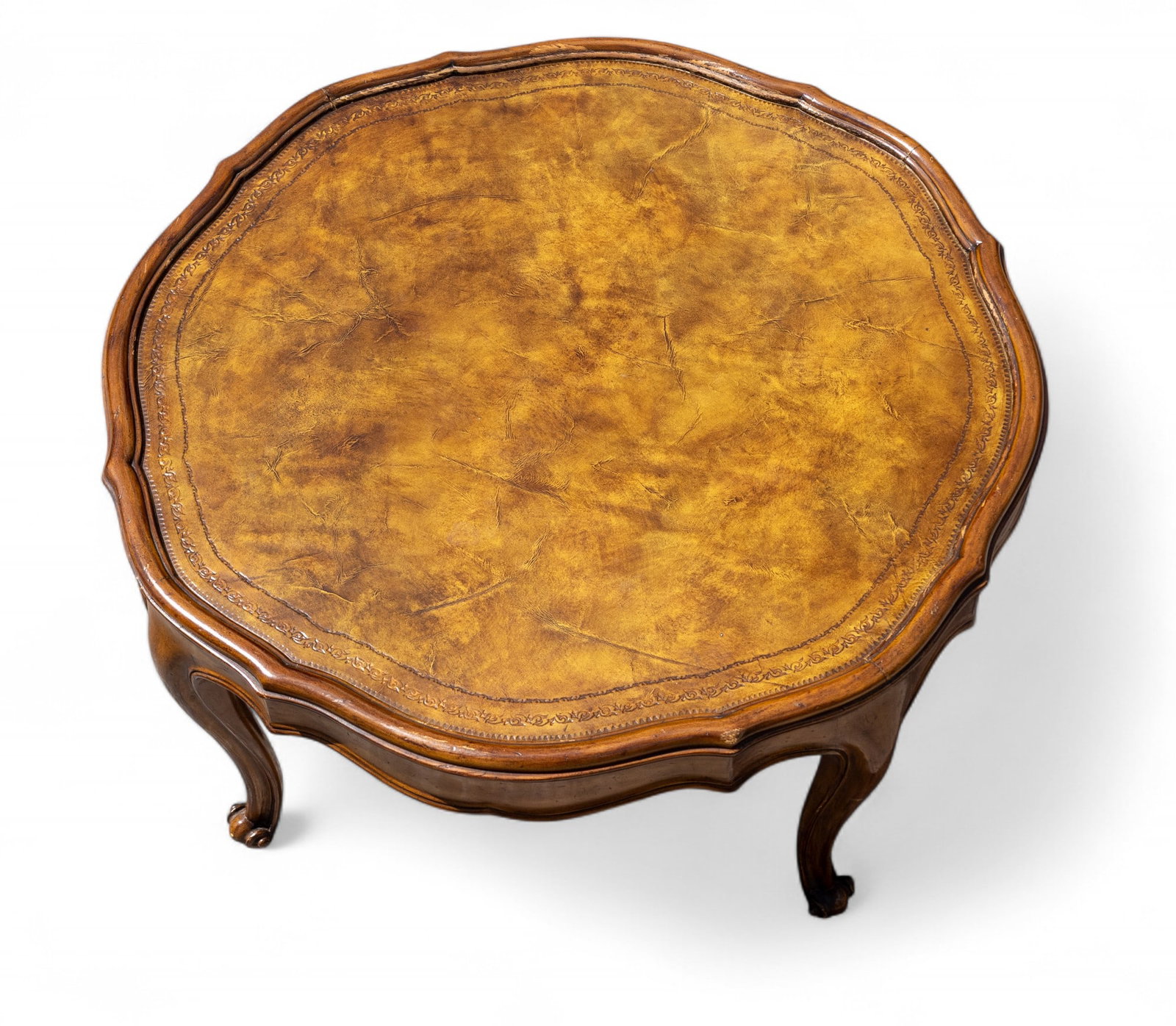Designer Leather Top Accent Table: A designer leather top accent table, attributed to Kindel Furniture Co. Measuring approx. 17" H x 29.5" Diameter.