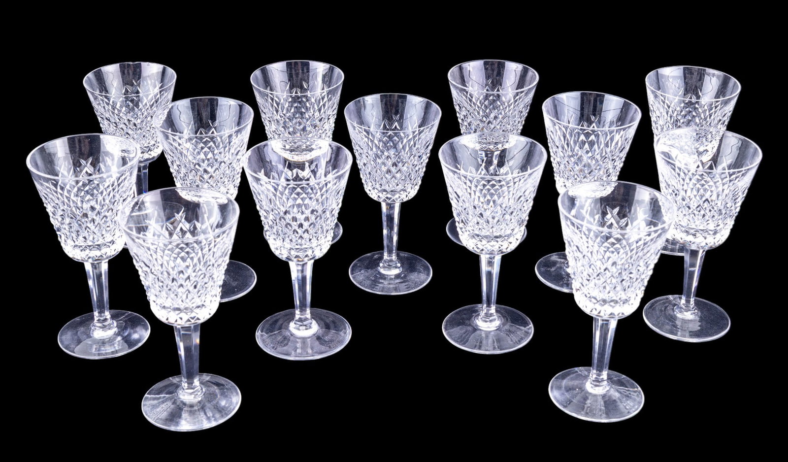 Waterford Alana Crystal Claret Wine Glasses (13): A collection of 13 Waterford crystal Claret wine glasses in the Alana pattern, note one glass has rim chip.