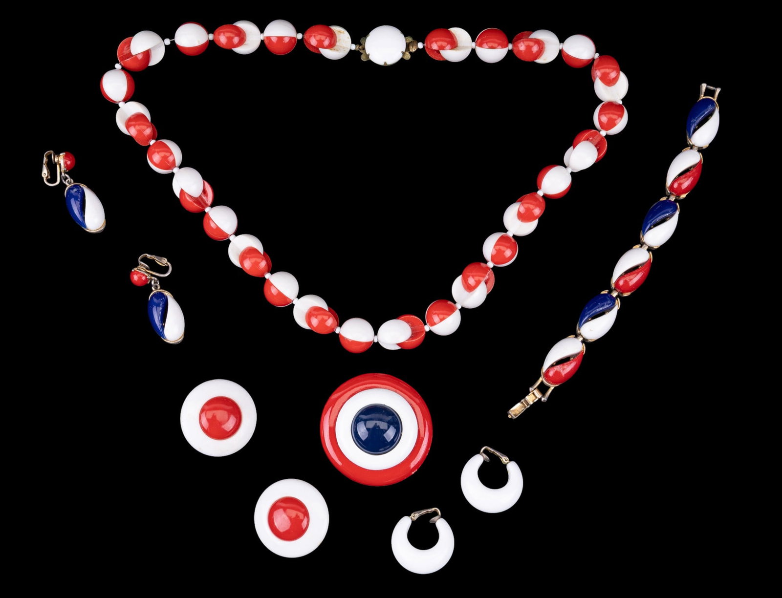 Vintage West German, Other Acrylic Jewelry: A vintage West German made acrylic necklace with matching red and white bulls eye style clip on earrings, a red, white, and blue acrylic bracelet and clip on dangle earrings, white acrylic clip on chu