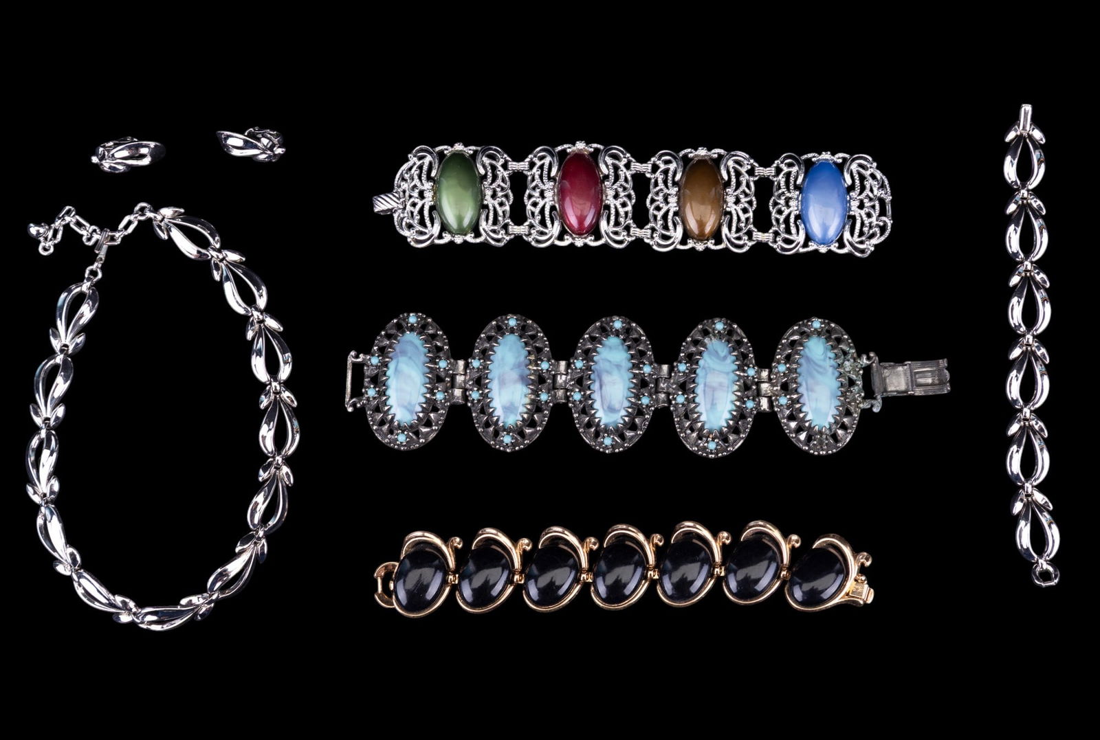 Vintage Trifari and Other Jewelry: Includes a 3-piece silver-tone Trifari set, a gold-tone and black stone Trifari bracelet, and two wide multi-color vintage bracelets.