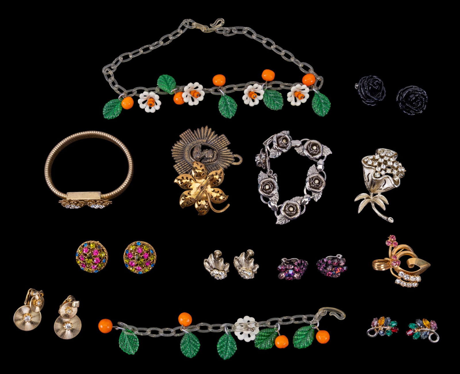 Coro and Vintage Estate Jewelry: Coro gold tone crystal rhinestone floral brooch with matching earrings, lucite orange with floral details necklace with matching bracelet, many styles of clip earrings, and more.