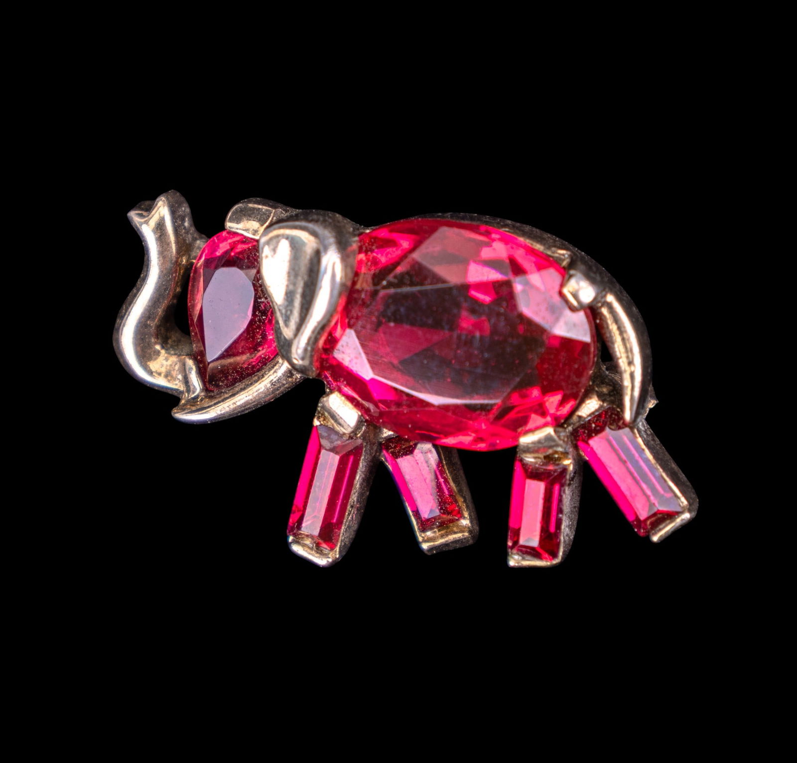 Vintage Trifari Miniature Elephant Brooch: Vintage Trifari miniature elephant brooch featuring ruby colored cut rhinestones.
