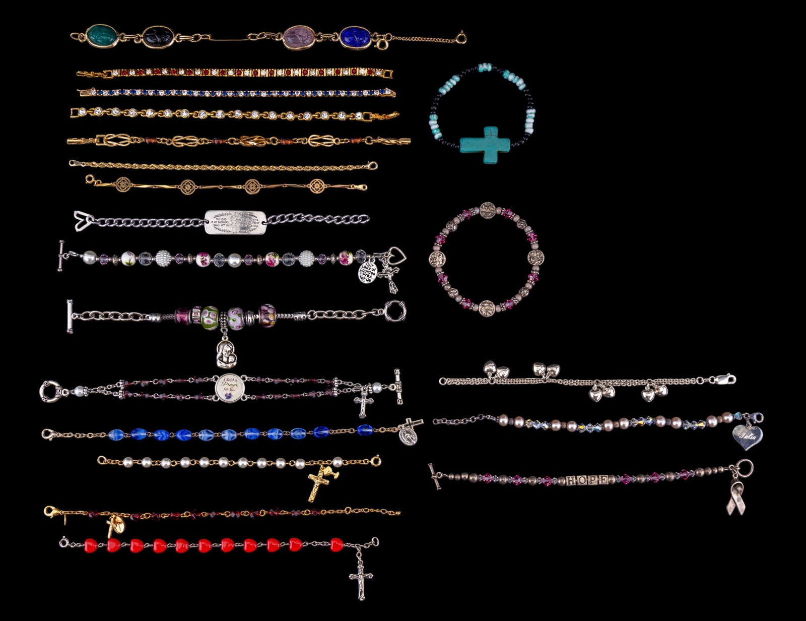 Rosary, Rhinestone, Sterling, & Charm Bracelets: A collection of Rosary bracelets, rhinestone tennis bracelets, scarab panel bracelet, personalized, Breast Cancer awareness jewelry, and sterling silver heart charm bracelets, and more.