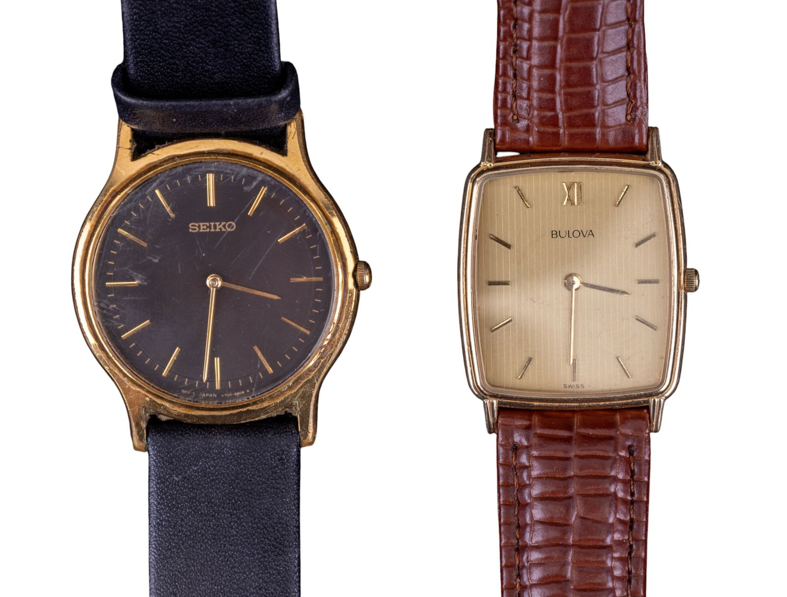 14K G Bulova and Seiko Battery Wrist Watches: A fine, slim profile, rectangular face Bulova battery operated wrist watch with genuine leather band, serial #357318, case #C832049, back weighs approx. 4.2g, and a vintage Seiko battery operated wris