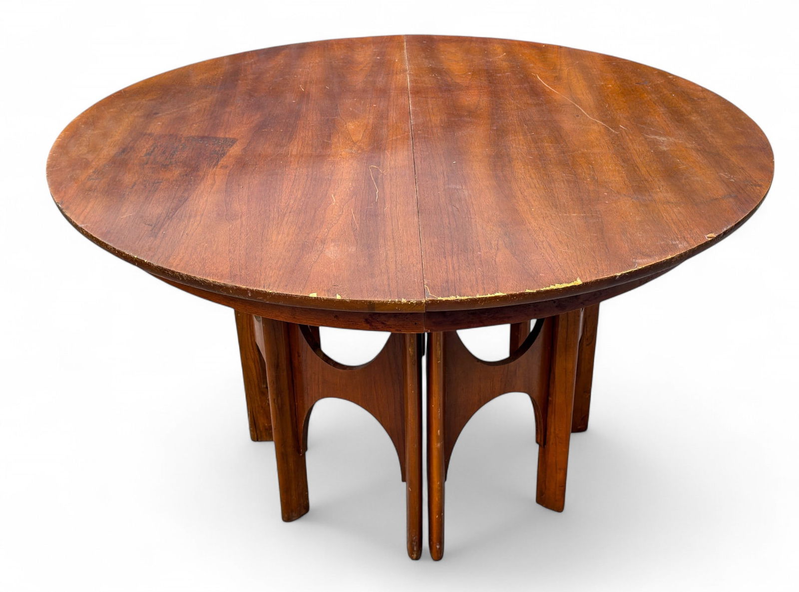 Brazilia Mid Century Modern Dining Table: Expandable Mid-Century Modern dinner table with great base design. Measures approx. 27.5" H x 48" Diameter closed. Expanded measures approx. 77" W, minus extension boards. Brazilia is the line of furn