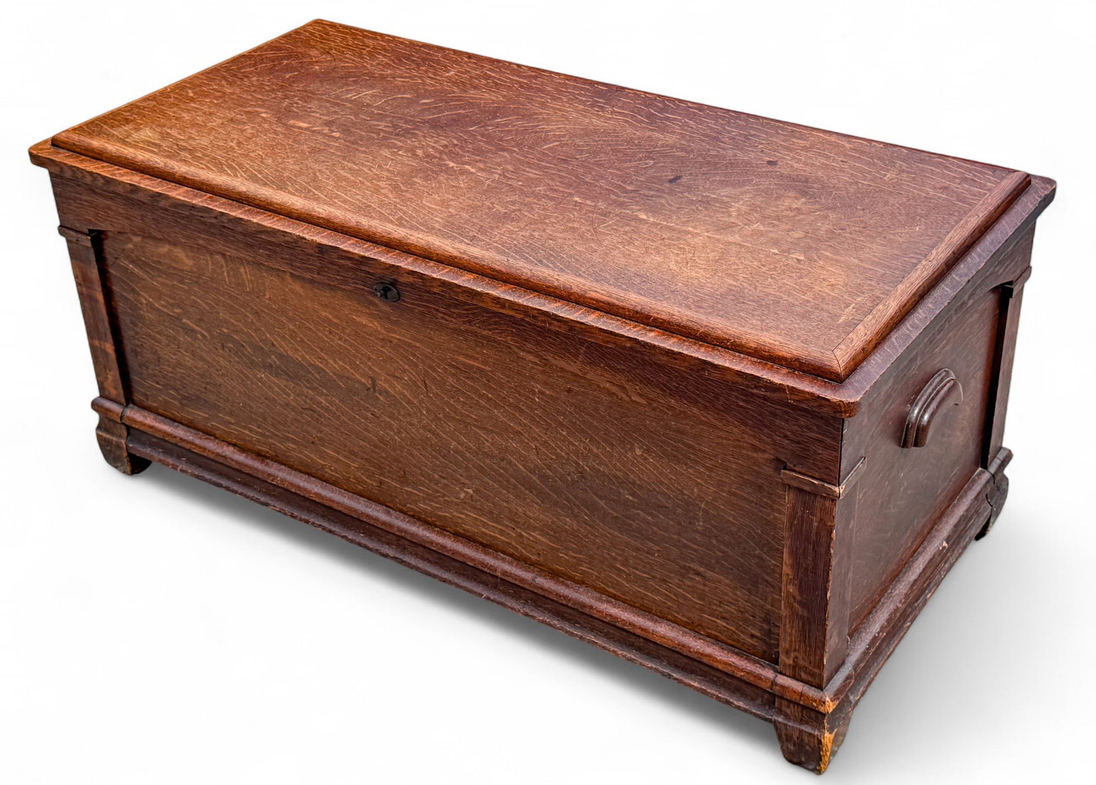 Oak Blanket Chest, Arts and Crafts Style: Carved oak blanket chest with carved handles. Appears to be cedar lined. Missing shelving insert, framing to hold insert is snapped. Measures approx. 20" H x 45" W x 22" D.