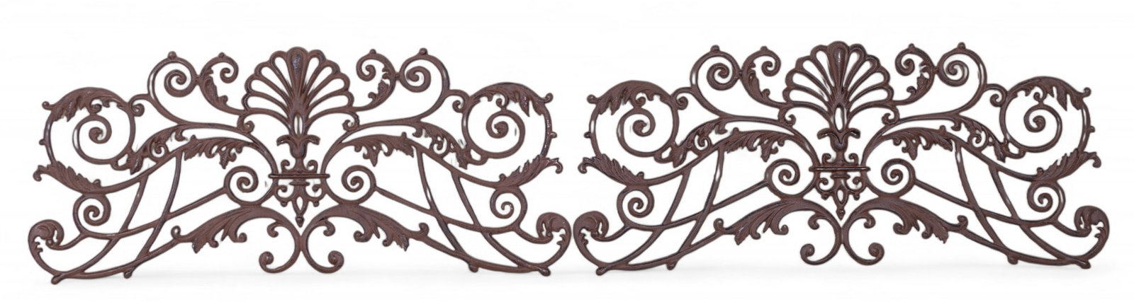 Pair of Cast Iron Scrollwork Wall Mounts: Pair of decorative cast iron wall panels, each with ornate scrollwork and leaf motif details. Each measures approx. 38" W x 16" H.