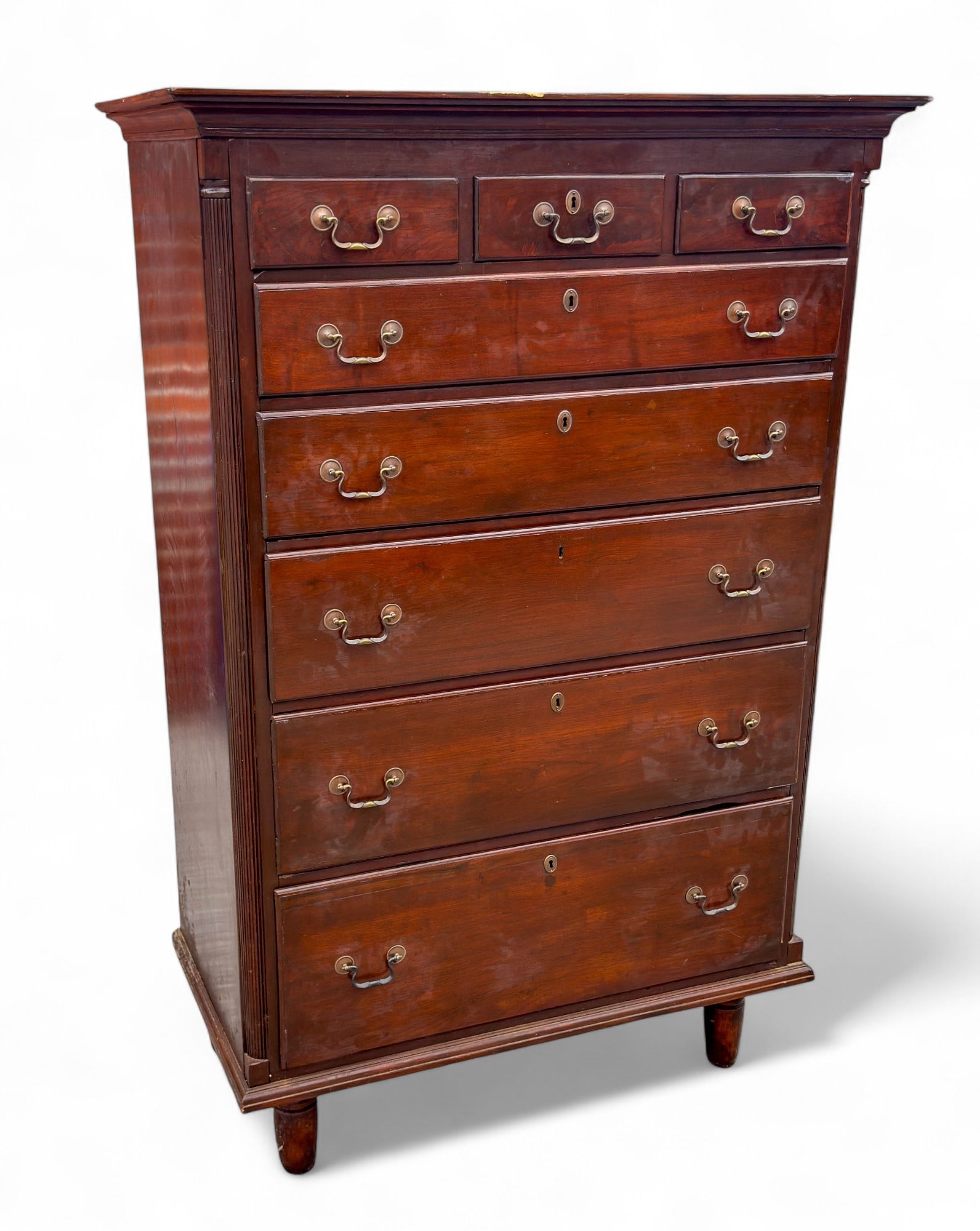 Antique Tall Chest of Drawers: Early 19th C 3 over 5 chest of drawers with replaced feet, graduated drawers. Drawer pulls not original. Backing has been reinforced with newer nails. Measures approx. 66" H x 43" W x 23" D.