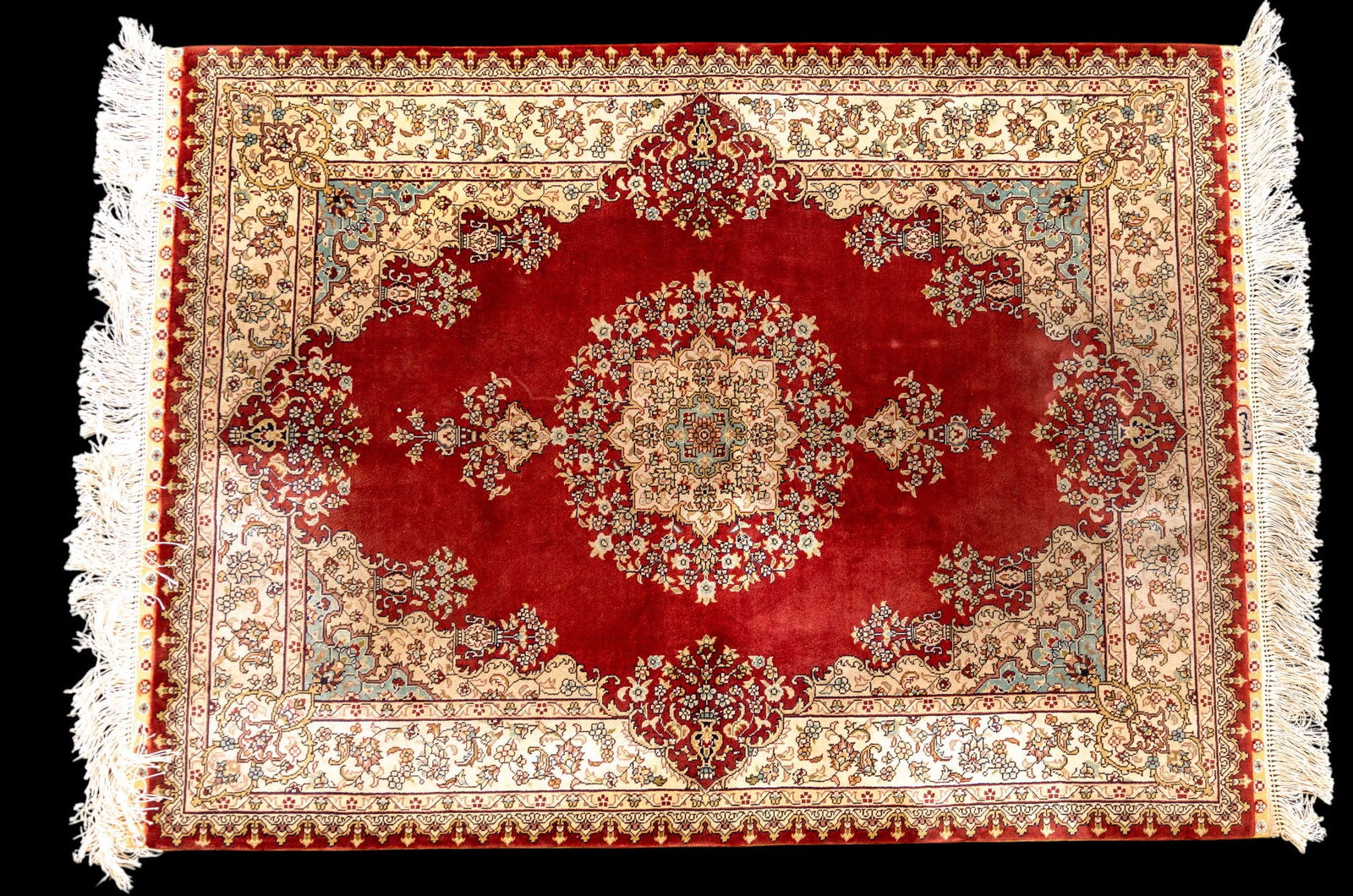 Persian Silk on Silk Carpet: Finely woven Persian silk on silk carpet, featuring intricate central medallion and floral borders. Measures approx. 3'7" x 2'7"