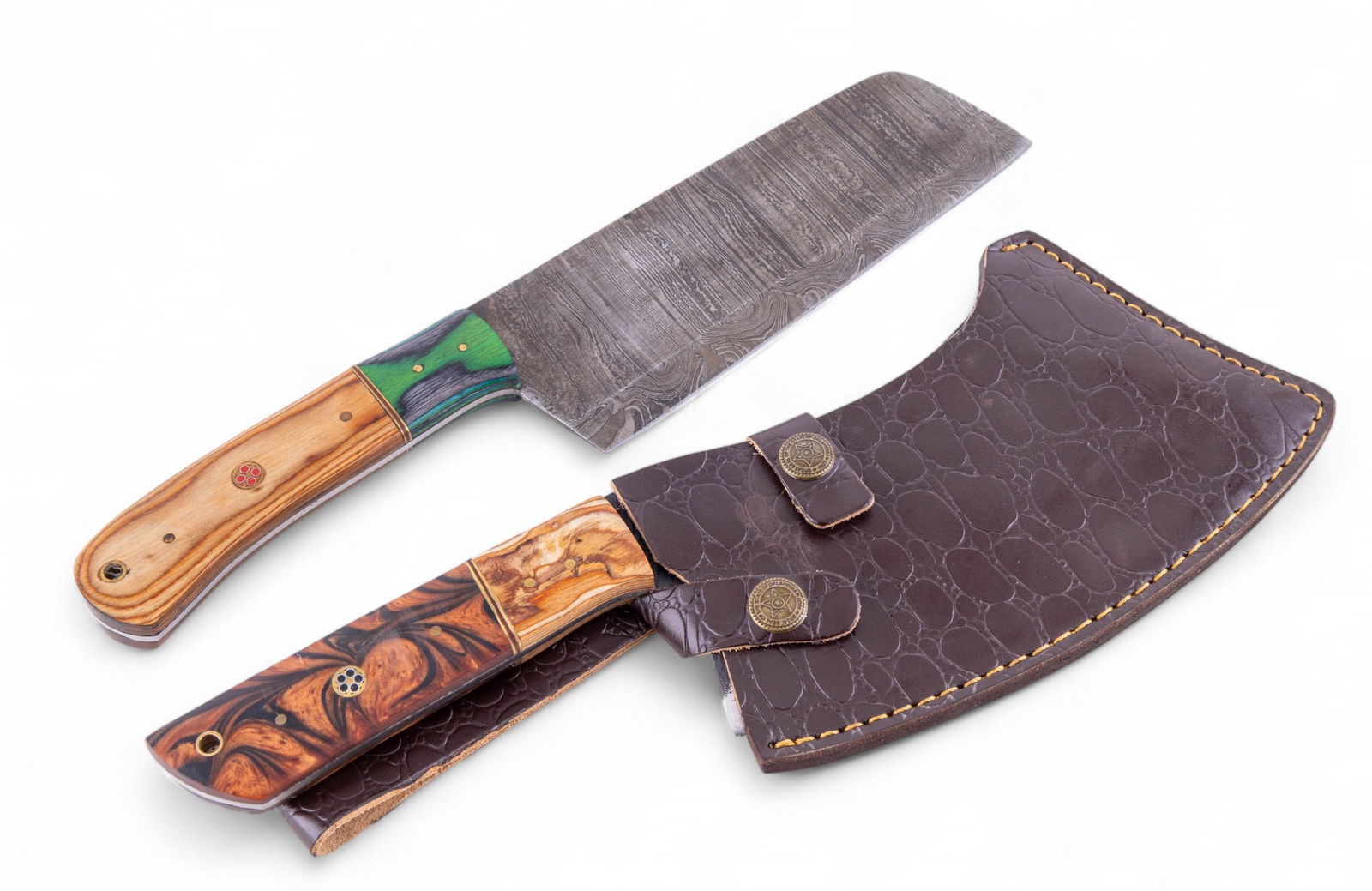 MHS Cutlery Damascus Steel Cleavers: A collection of two MHS Cutlery folded Damascus steel blade cleavers featuring dyed wood and brass inlay handles, only the larger cleaver includes a stamped genuine leather sheath.