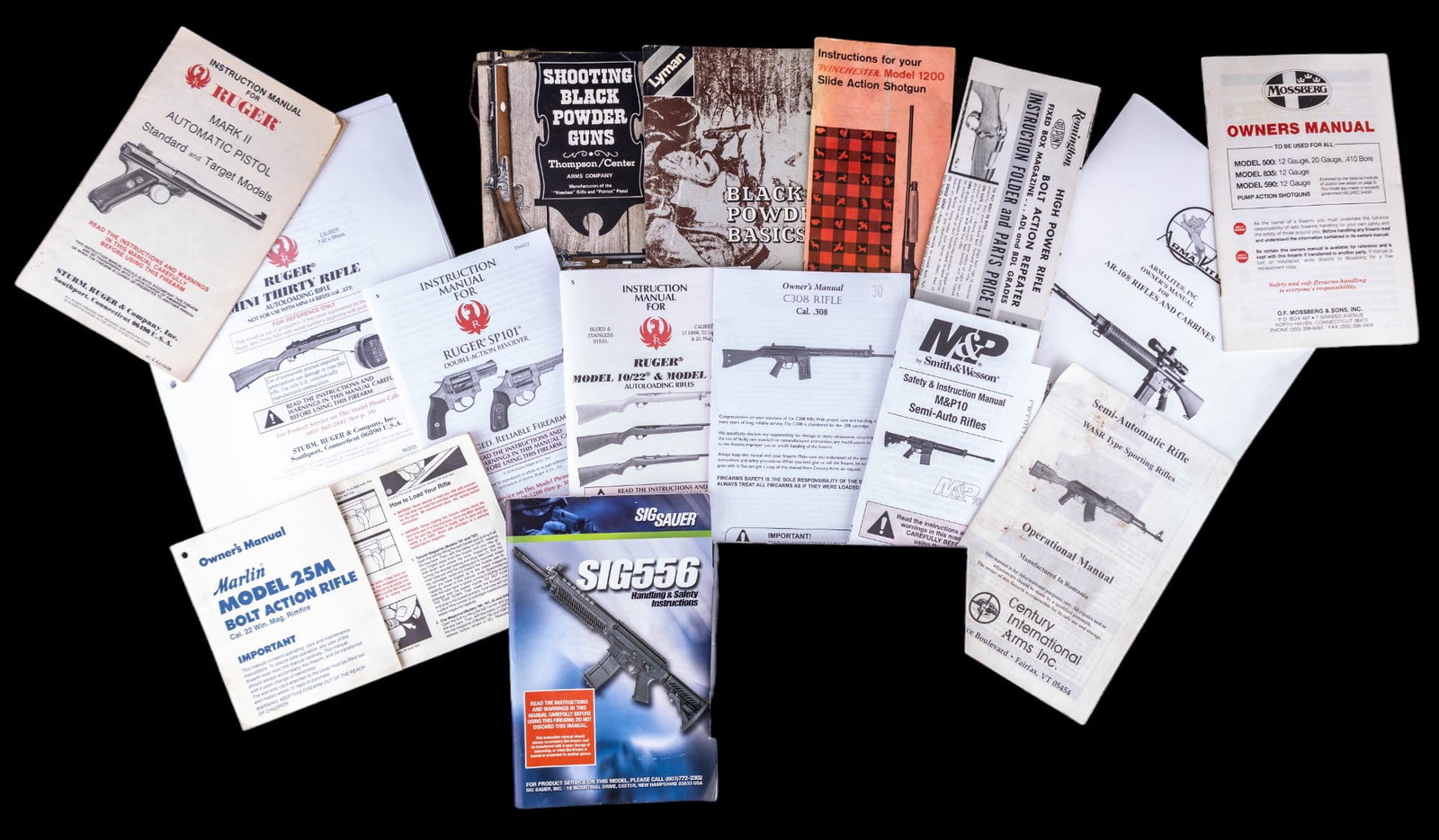 Firearms Manuals and Advertisements: A collection of various firearms owners manuals and advertising ephemera including a Black Powder Basics booklet, Mossberg, Sig Sauer, and other owners manuals.