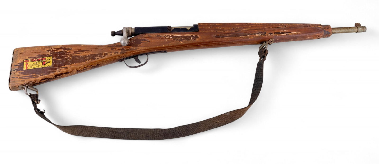 Pariss Kadet Trainer Rifle: Vintage Pariss Kadet Trainer Rifle, manufactured in Savannah, Tennessee. Wooden stock with original "Kadet Trainer Rifle" decal, marked butt plate, and canvas sling. Measures approx. 32.5" L.