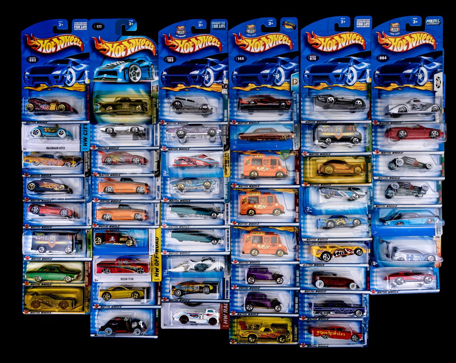Hot Wheels Die-Cast Cars, Carded: Group of approx. 50 Hot Wheel cars, all still sealed on their original cards. Includes a mix of fantasy racers, trucks, hot rods, and muscle cars. Notable models in this lot include Bone Shaker (#006)