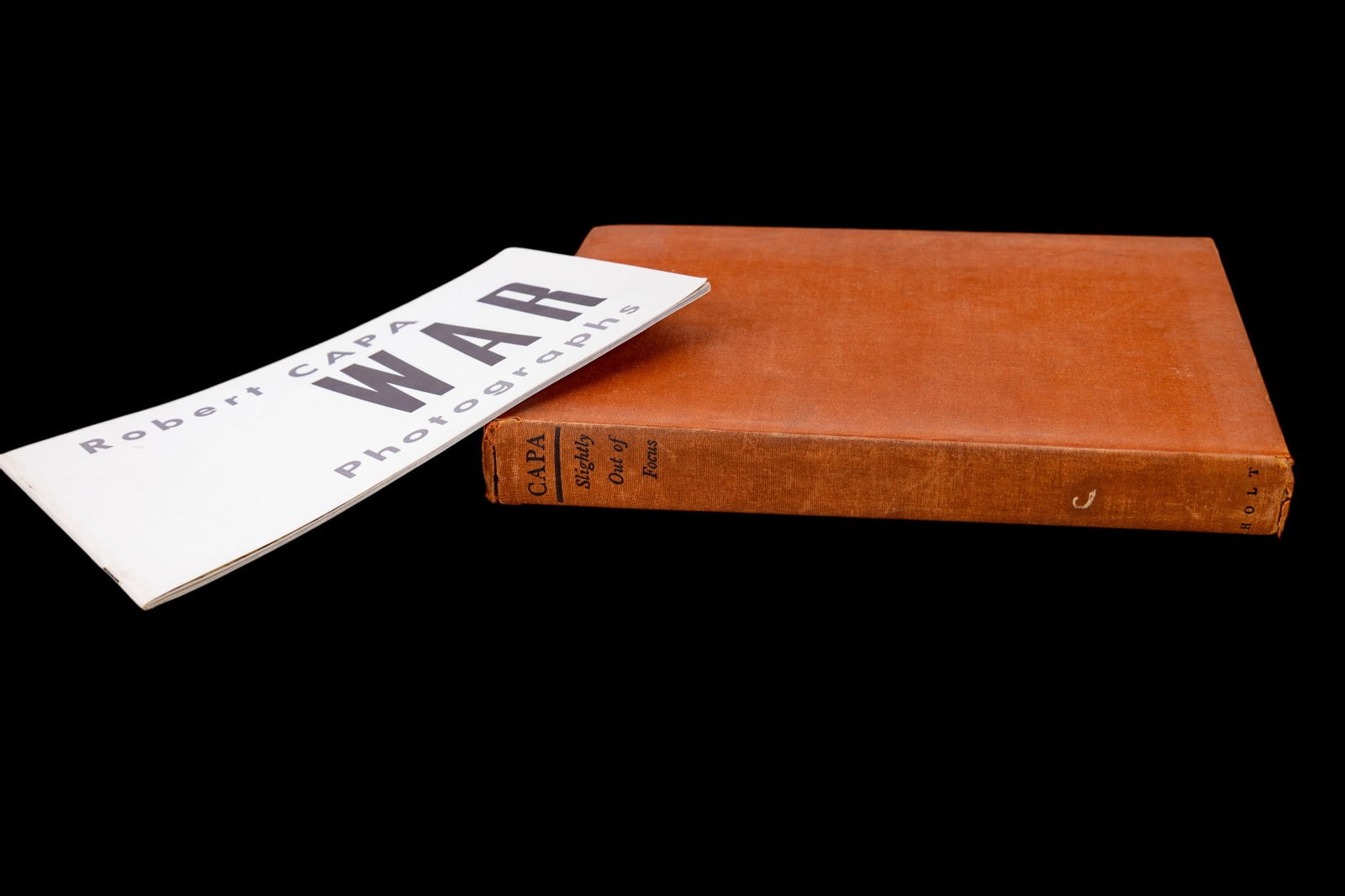 Robert Capa Photography Book and Booklet: A pair of works by war photographer Robert Capa, including Slightly Out of Focus (Henry Holt & Co., New York, 1947, first edition (ex-library copy) and War Photographs exhibition booklet, produced by