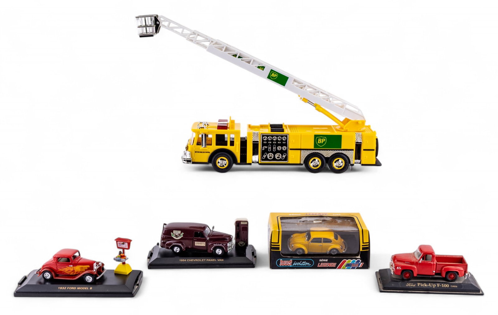 Group of Die-Cast and Model Vehicles: Includes BP Aerial Tower Fire Truck 1999 Collector's Edition in box, Hershey's 1954 Chevrolet panel van display model, 1953 Ford F-100 red pickup truck, 1932 Ford Model B hot rod coupe with display, a