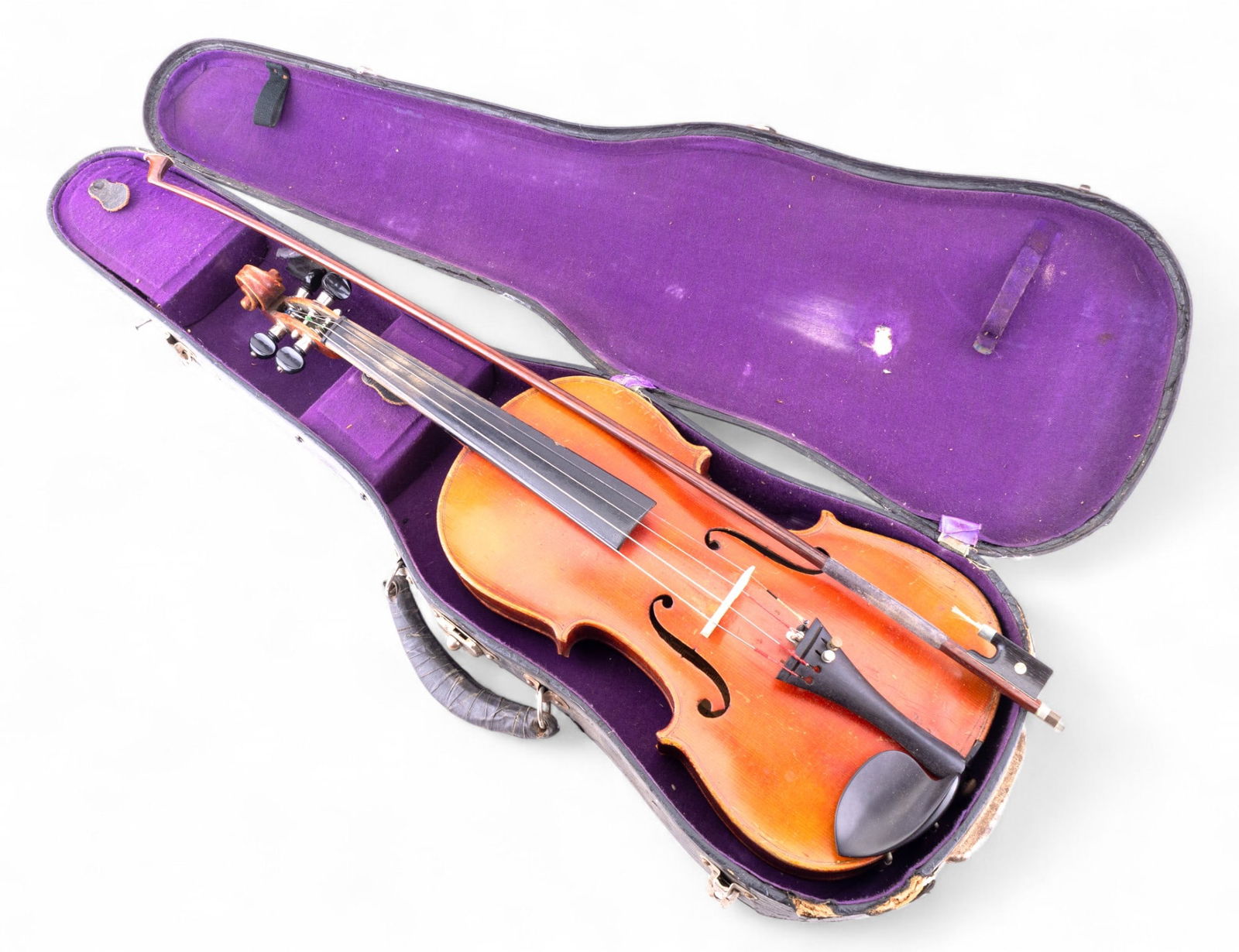 Early Violin and Case: Early violin marked on the interior 'Antonius Stradiuarius Cremonenfis Faciebat Anno 17' and bow marked 'Nippon', not a confirmed original, includes case. Note heavy wear due to age and use.