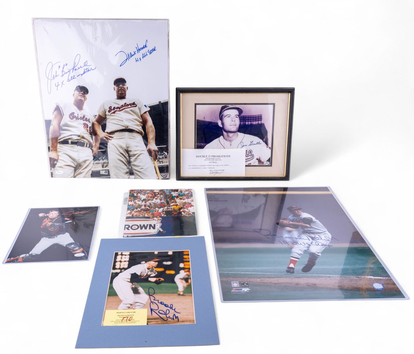 Baltimore Orioles Signed Photos: A collection of Baltimore Orioles signed player photos including a 16x20 and 8x10 signed by Brooks Robinson, an 8x10 signed by Adley Rutschman, an 8x10 signed by Brady Anderson, a framed photo signed