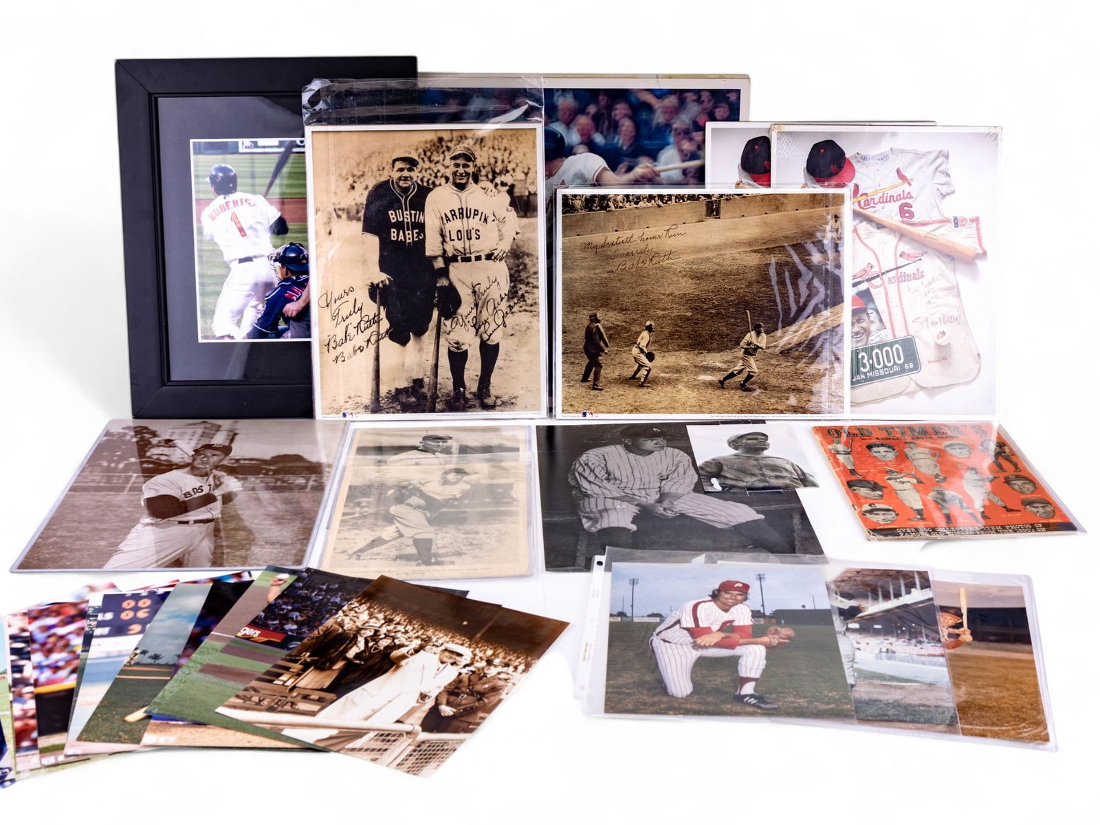 Vintage MLB Player Photos: A collection of vintage MLB player photos featuring a 16x20 of Baltimore Orioles player Brooks Robinson, 3 11x14 copies of 'No. 12 Stan the Man Musial' memorabilia montage posters, an assortment of 8x