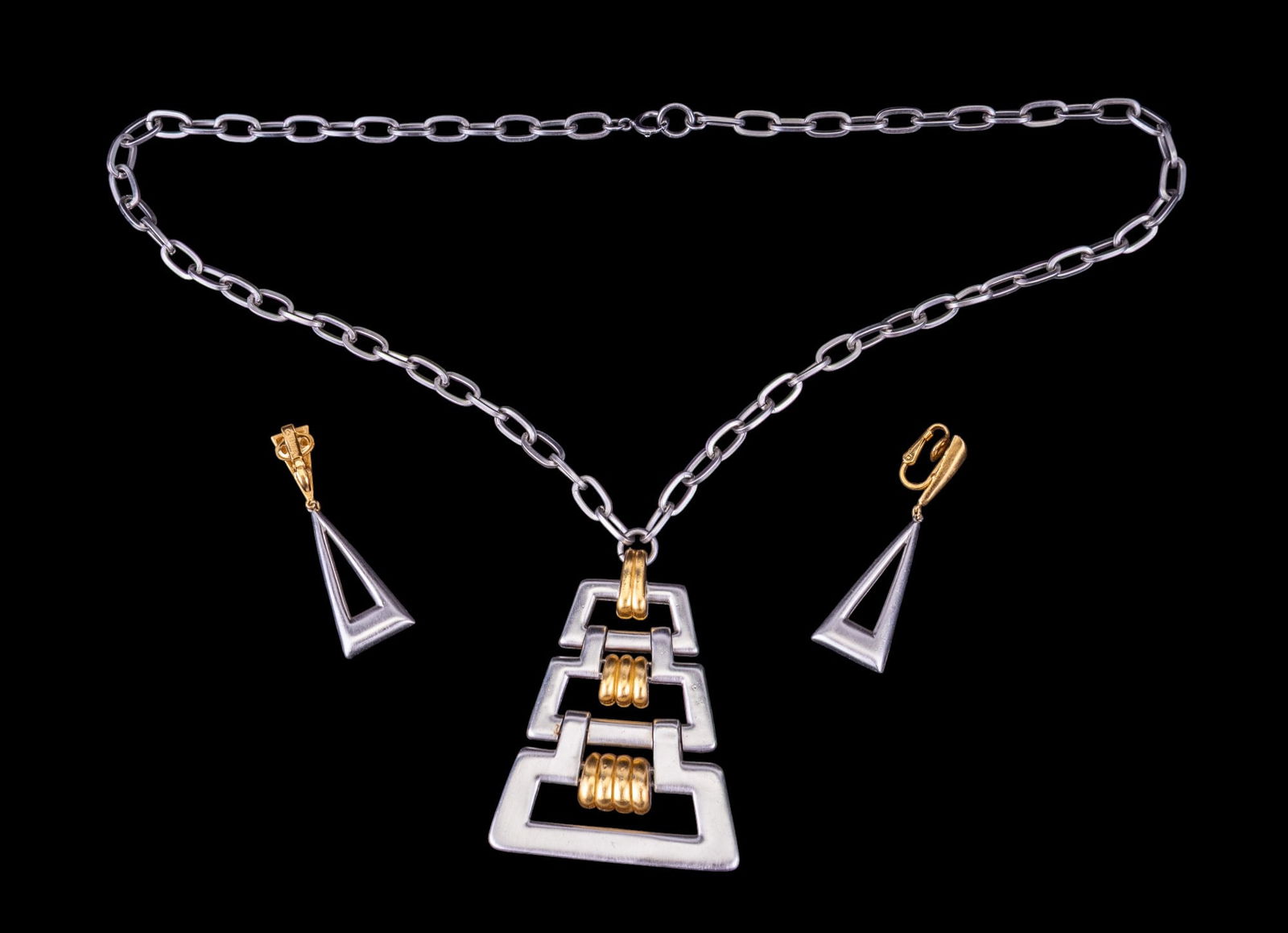 Vintage Trifari Necklace + Earrings: Circa 1990s silver-tone large necklace with matching clip earrings.