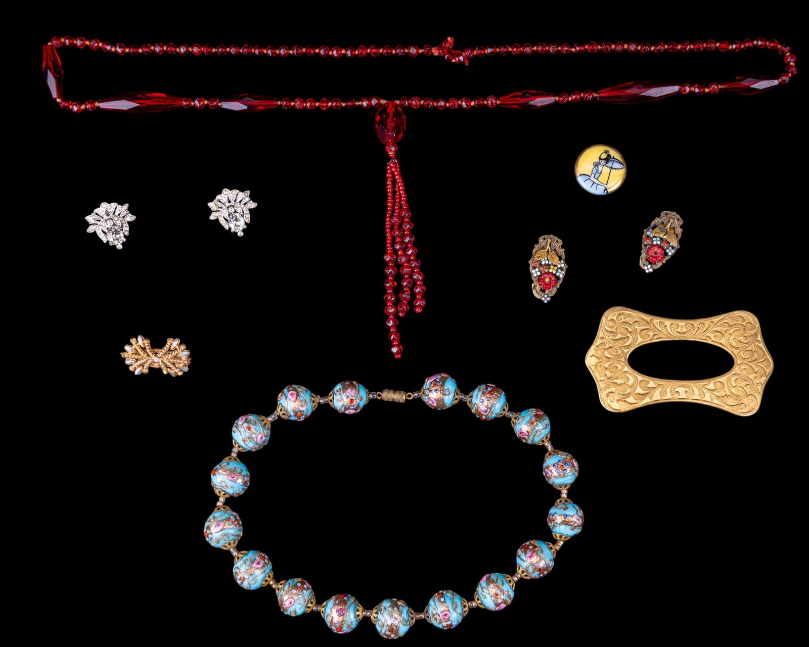 Early Trifari Phillippe Clip Earrings + More: Silver-tone Alfred Phillipe Trifari clip earrings, several glass necklaces, vintage pins, small clips, and more.