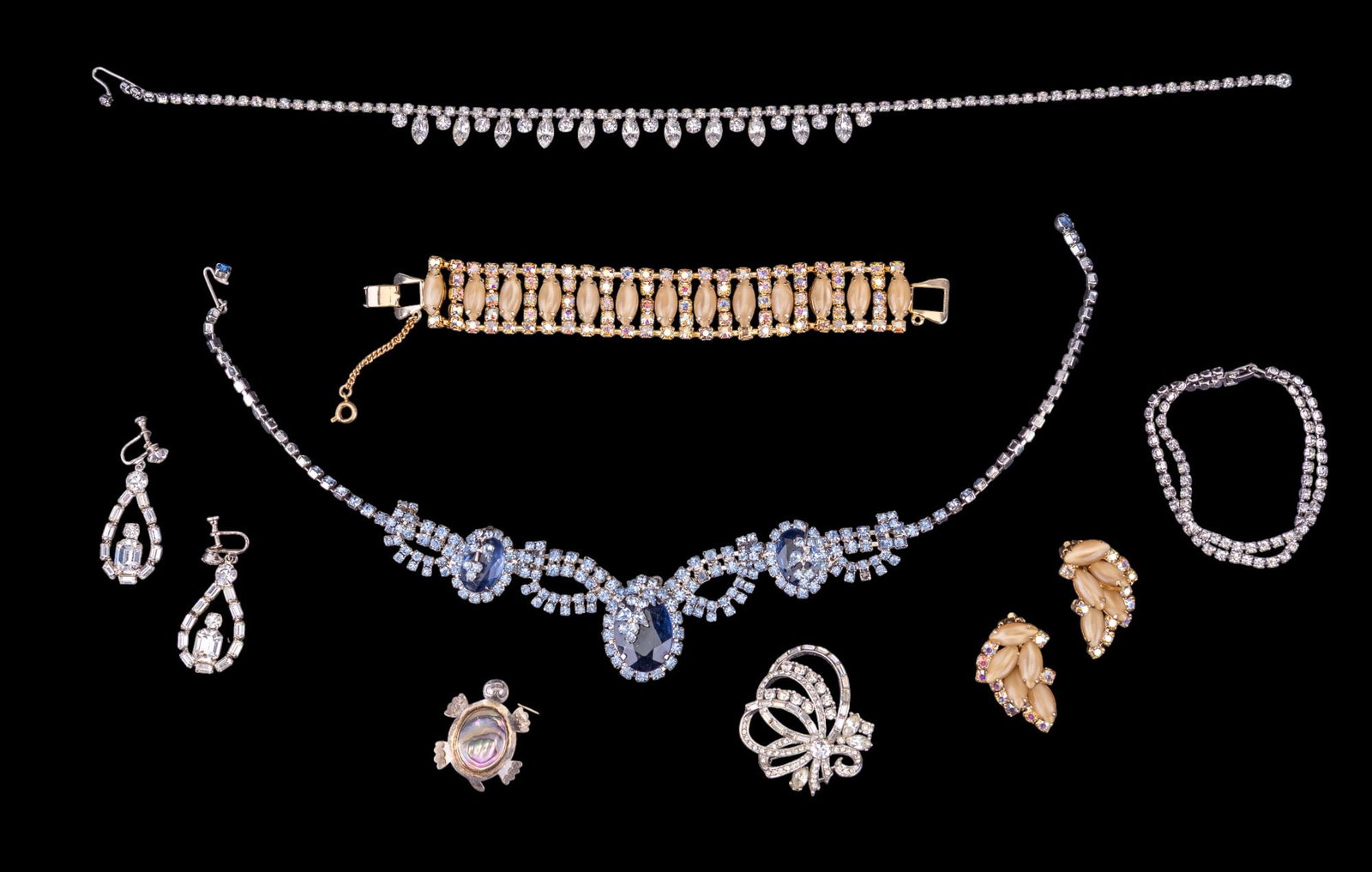 Exceptional Vintage Rhinestone Jewelry: Includes a large light and dark blue rhinestone necklace, yellow-hued wide rhinestone bracelet with matching clip earrings, and other vintage rhinestone and costume pieces.