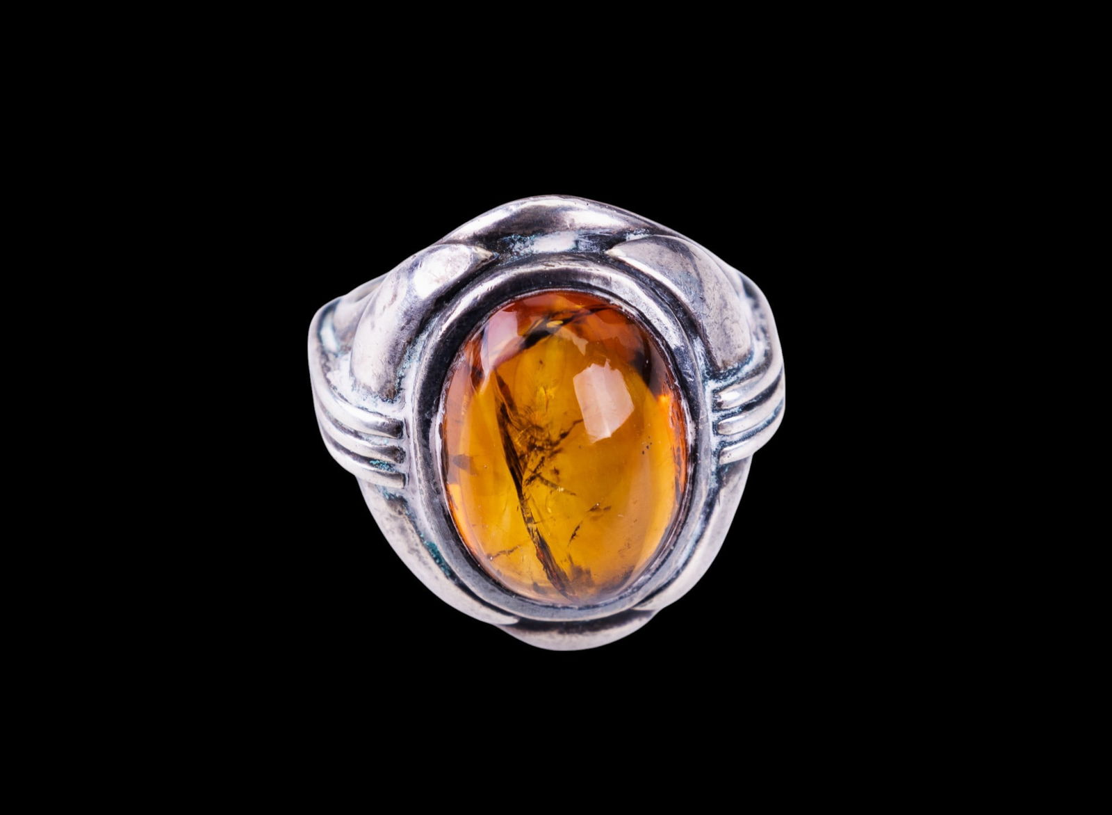 Fine Sterling Silver Amber Ring: Large sterling silver and amber set ring, ring is unsized and unmarked.