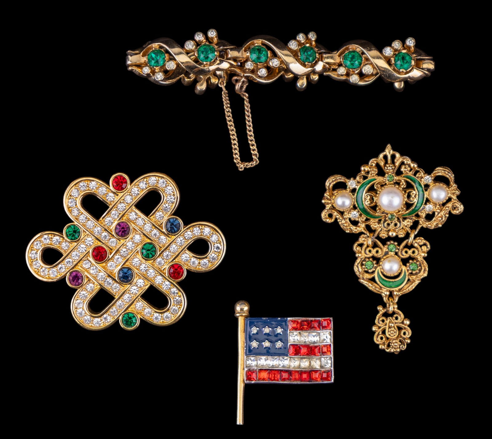 Mazer Bros and Swarovski Jewelry: Includes a gold tone and green stone bracelet signed "Mazer Bros," a multi hued Swarovski brooch, unsigned. Also includes a Florenza brooch and a vintage flag brooch.