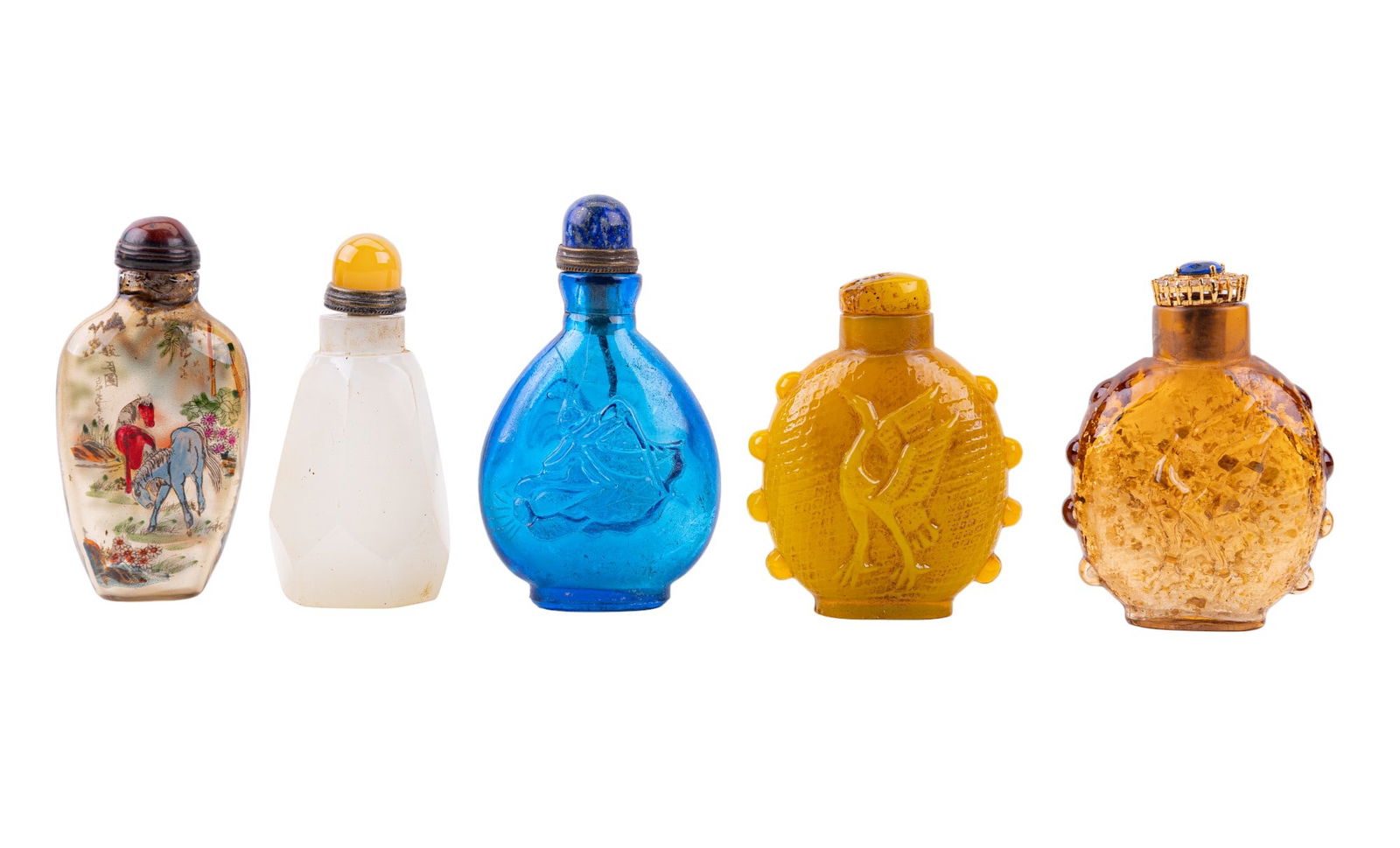 Glass Snuff Bottles: A collection of five Chinese snuff bottles including designs such as clear blue glass, translucent white glass, yellow Peking glass, clear brown glass with gold colored flecks embedded, and a reverse