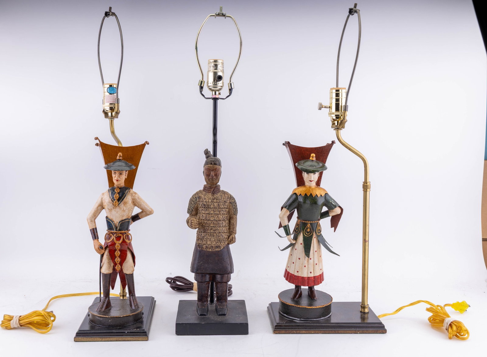 Chinese Inspired Table Lamps (3): A collection of three Chinese inspired table lamps including a matching set depicting figures of Ancient Chinese man and woman warriors made from painted tin, untested, measures approx. 25" H to finia