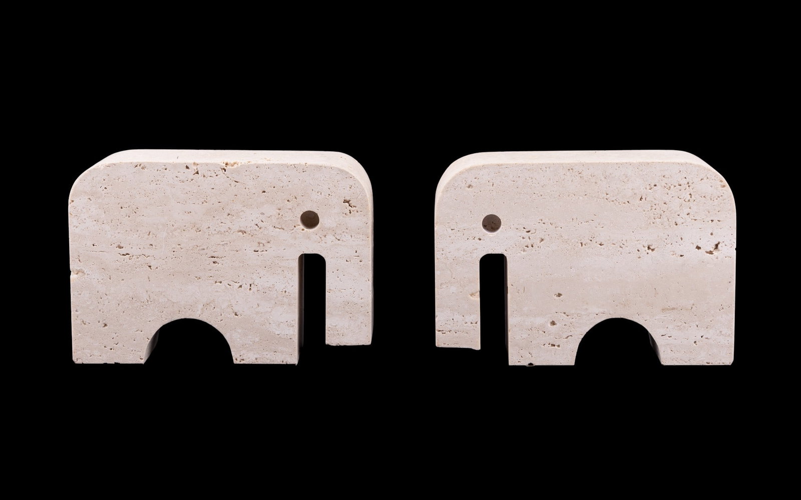 Figural Stone Elephant Bookends: A pair of figural, stylized stone elephant bookends. Each measures approx. 4.5" H x 6.5" W x 2".
