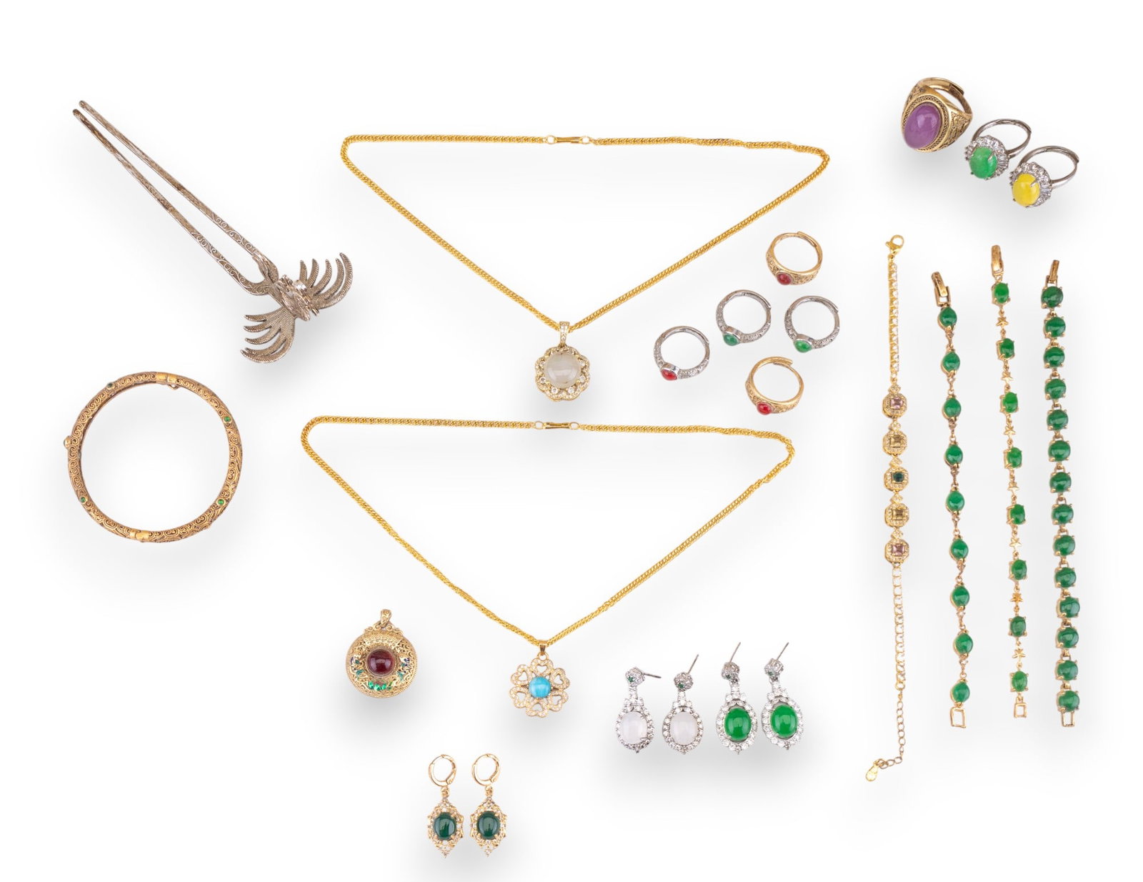 Gold Tone and Jade Jewelry: A collection of gold and silver tone jewelry featuring gold and silver tone rings with jade cabochons, a reticulated gold tone hinged bangle, silver tone hair pin, gold tone tennis bracelets with jade