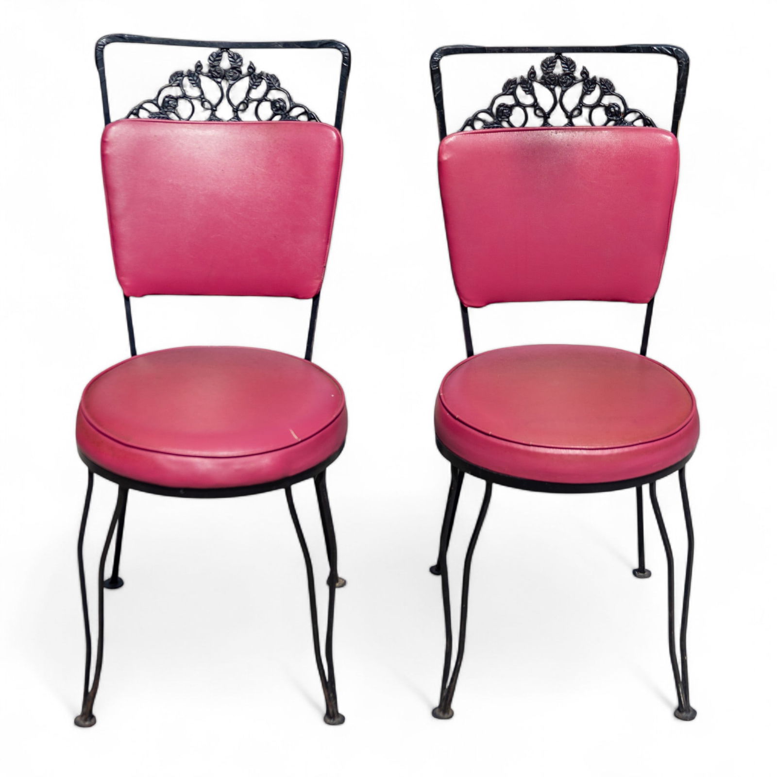 Vintage Pink and Iron Work Kitchen Chairs, Pair: A pair of wrought iron patio/kitchen chairs. Each chair measures approx. 38" H x 16" W x 18" D. KAI#309.58A