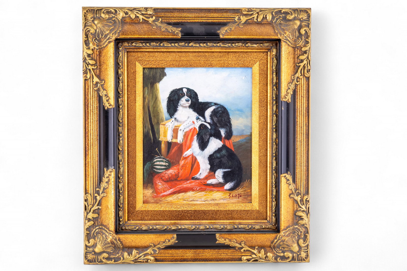 Oil on Panel of 2 Spaniels, Signed: Oil on panel painting depicting 2 spaniels posed on a red drape with classical landscape background, signed "Scot" lower right. Presented in a deep gilt and black molded frame. Measures approx. 17.75"