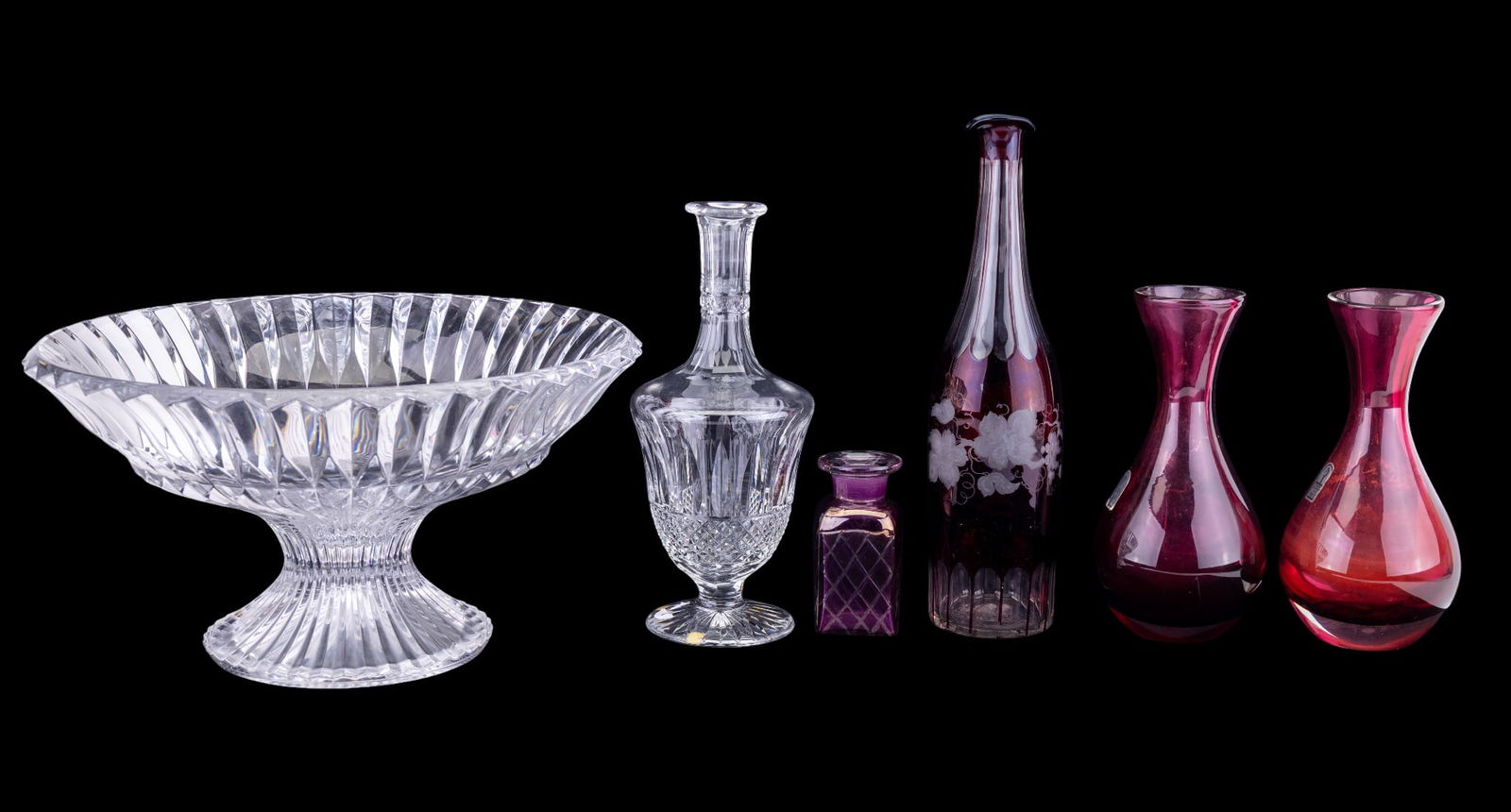 St. Louis Crystal Decanter, Colored Glassware: A collection of cut crystal and fine blown glass vessels featuring a St. Louis France cut crystal 'Tommy' wine decanter, 13" H to the stopper, two heavy blown cranberry glass vases by Pilgrim Glass, 8