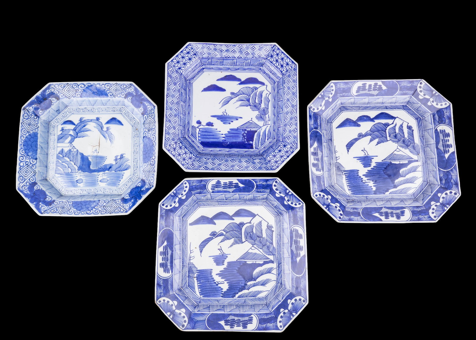 Meiji Blue and White Imari Porcelain Chargers: A collection of four blue and white Meiji Imari squared porcelain chargers, depicting landscape scenes, diam. measures between approx. 13" and 14.5". Note, one charger is attributed to the Tempo Perio