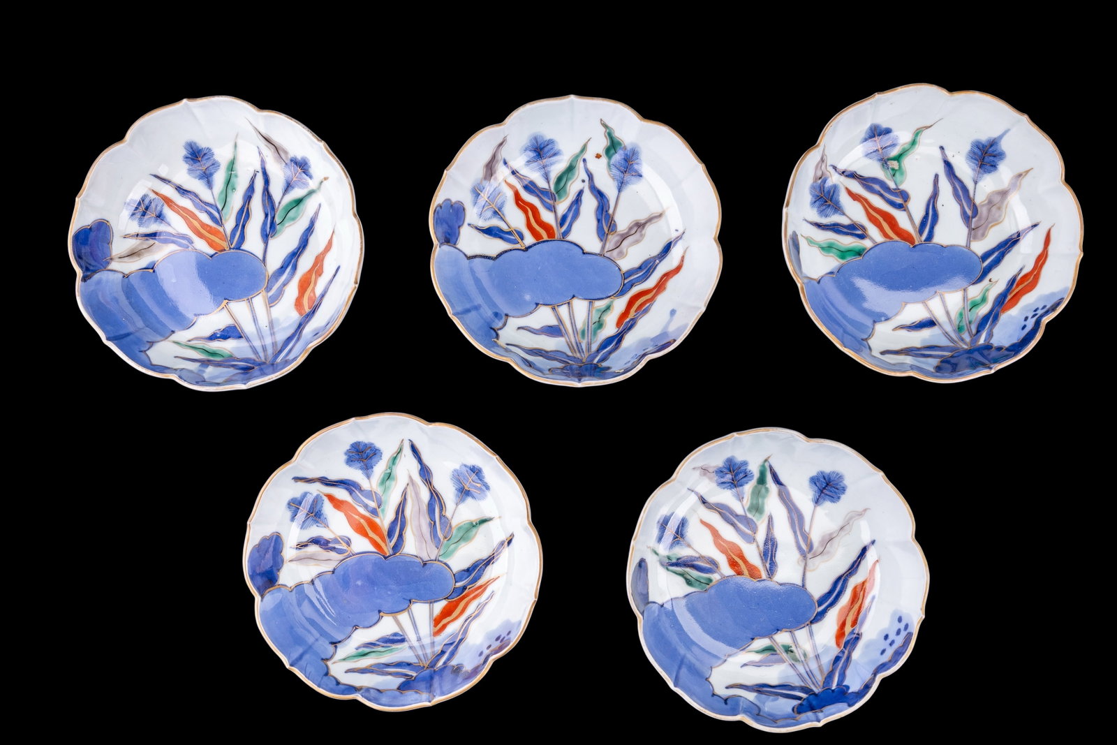 Japanese Imari Porcelain Bowls (5): A set of five Japanese Imari porcelain bowls c. early Meiji period, featuring a millet plant and cloud motif, fluted curve edge, and signed with four characters on the bottom, measures approx. 7" diam