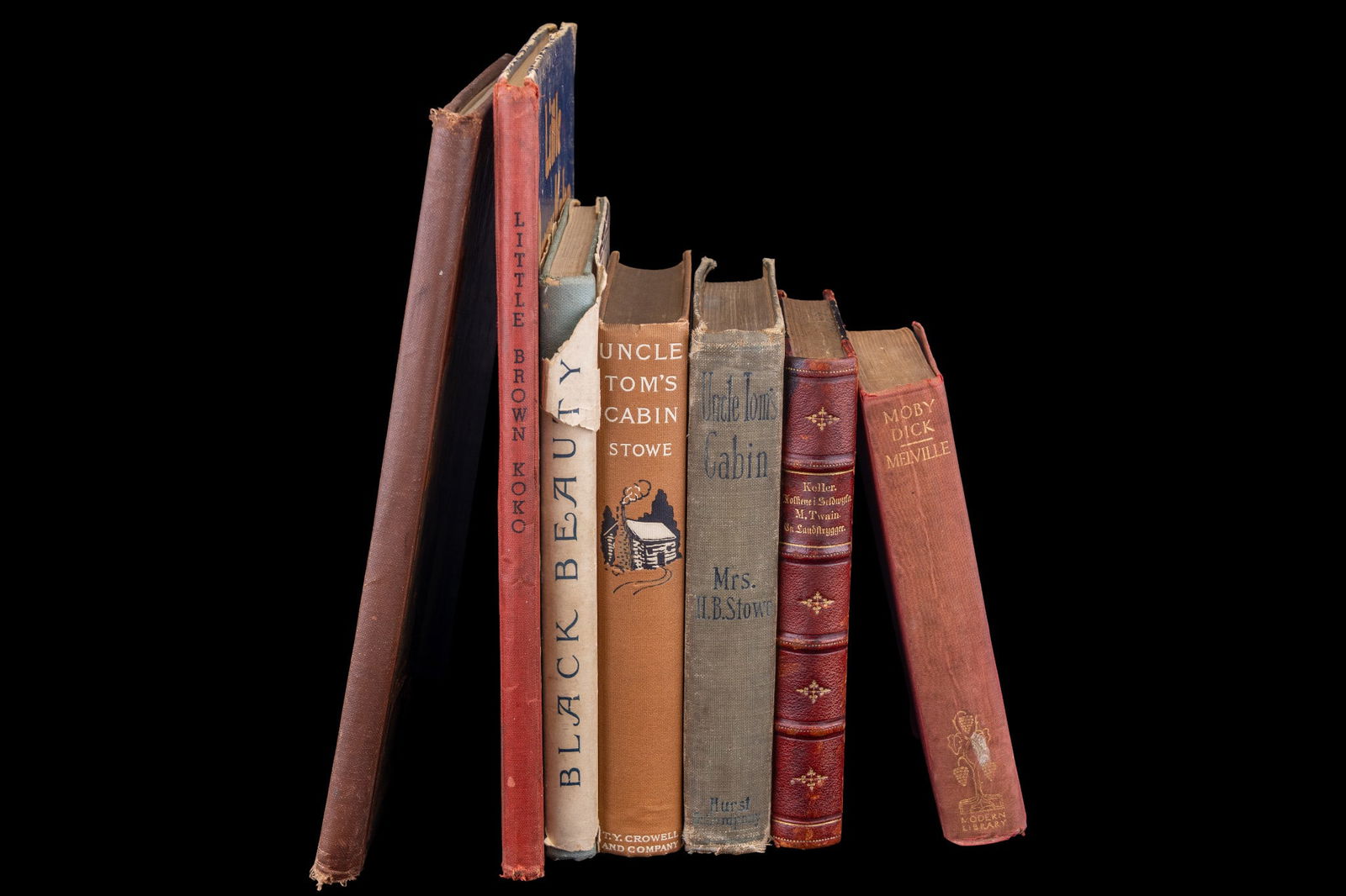 Early 20th C Books, Classics: A collection of early 20th C books including Moby Dick by Melville, c. 1926, 'Black Beauty' by Gorham, c. 1905, two copies of 'Uncle Tom's Cabin' by Stowe, c. 1900 and copyright 1897, and others.