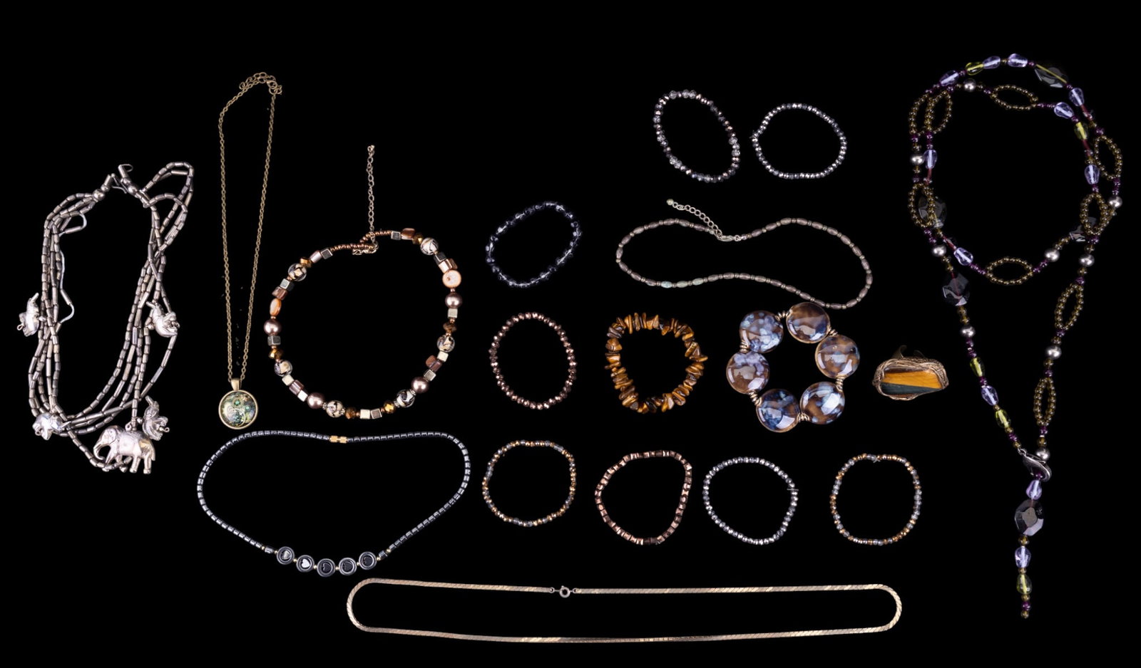 Necklaces and Bracelets: Includes a variety of glass, stone and costume necklaces as well as some stretch bracelets.