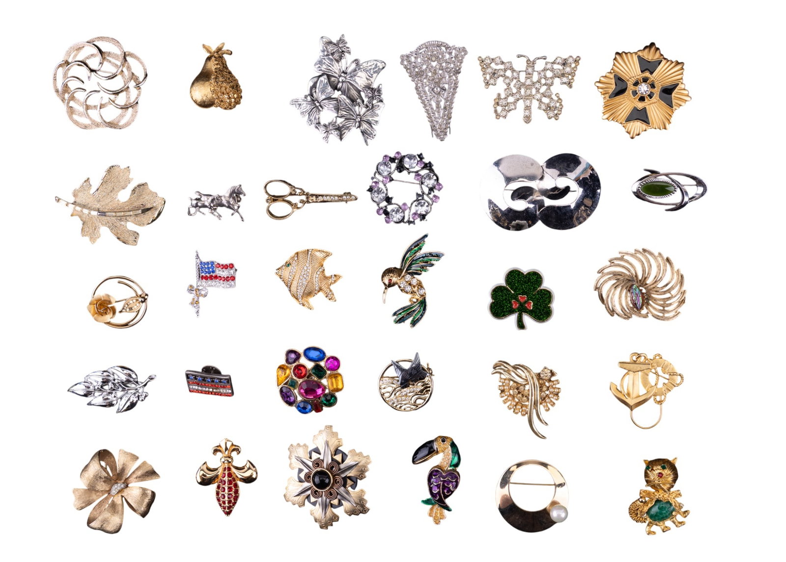 Designer Rhinestone and Other Brooches: A collection of 30 rhinestone, gold and silver tone, and enamel designer brooches featuring a Fleur De Lis by Swarovski, a gold tone pear marked B.S.K., various Sarah Coventry, and others.