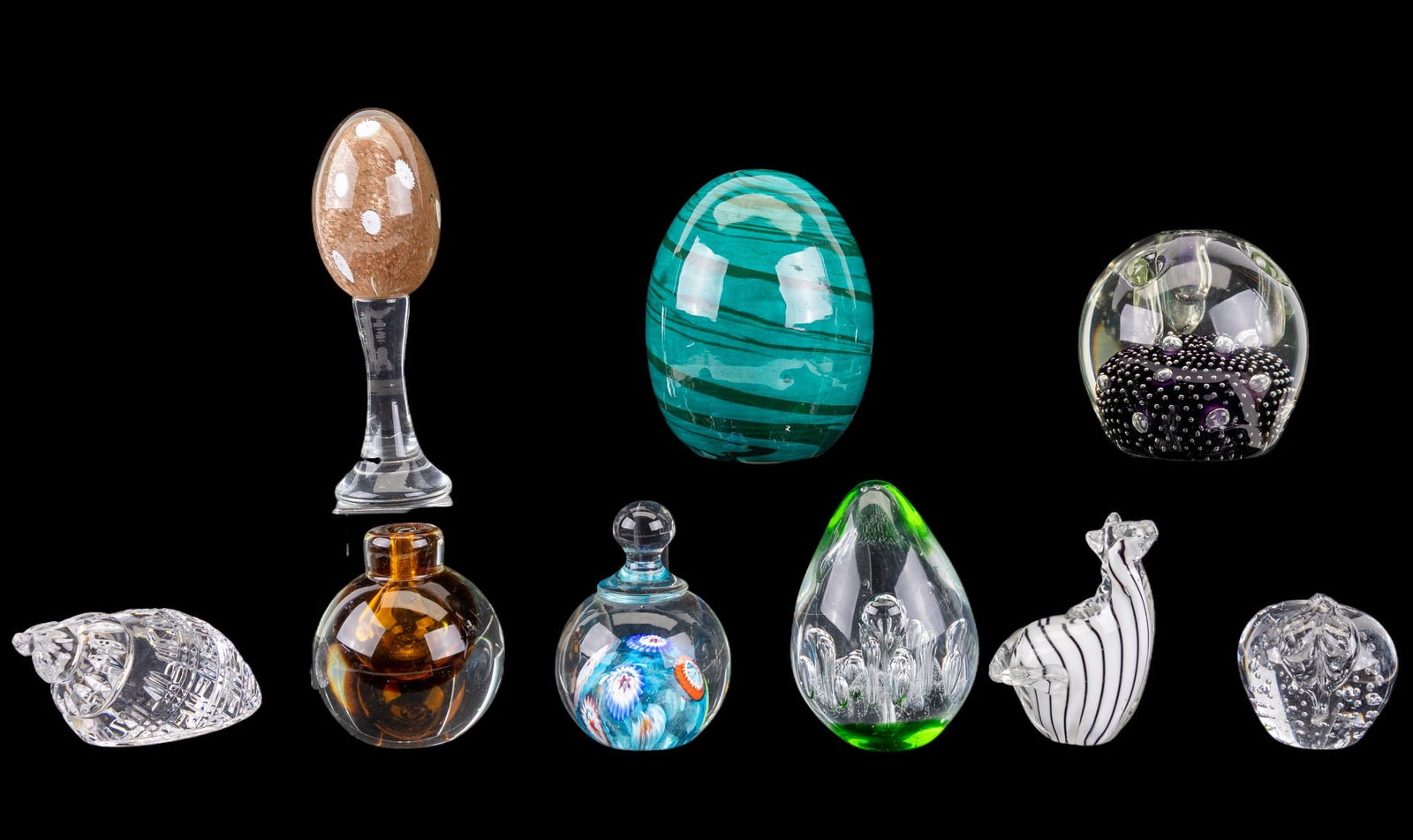 Art Glass and Waterford Figurines: Group of 10 art glass pieces including controlled bubble and millefiori paperweights, an amber glass inkwell, a controlled bubble pen holder, clear apple and pear form paperweights, and a cut crystal