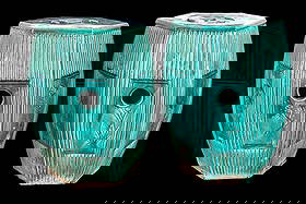 Chinese Porcelain Majolica Glazed Garden Stools: A pair of fine green majolica glazed hexagonal Chinese porcelain garden stools featuring floral relief and ribed design, measuring approx. 12" W 10" D x 18" H