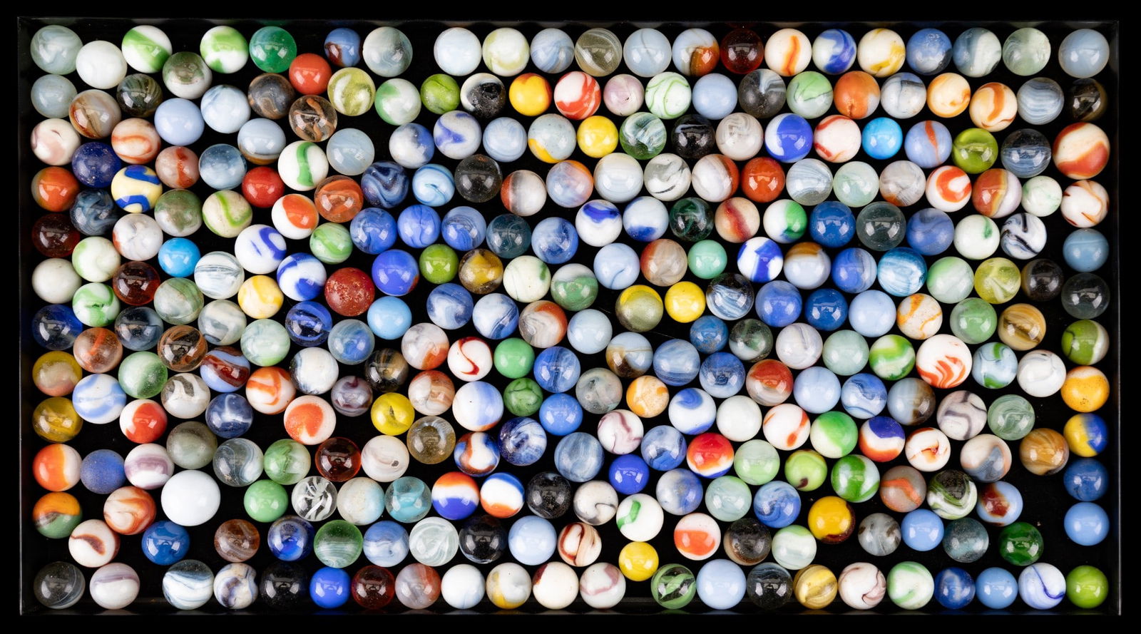 Marble Collection: A collection of marbles with examples including: milk glass swirl, clear glass swirl, and others in a variety of colors and patterns. Approx. 120 marbles total. Various ages including vintage, sizes,