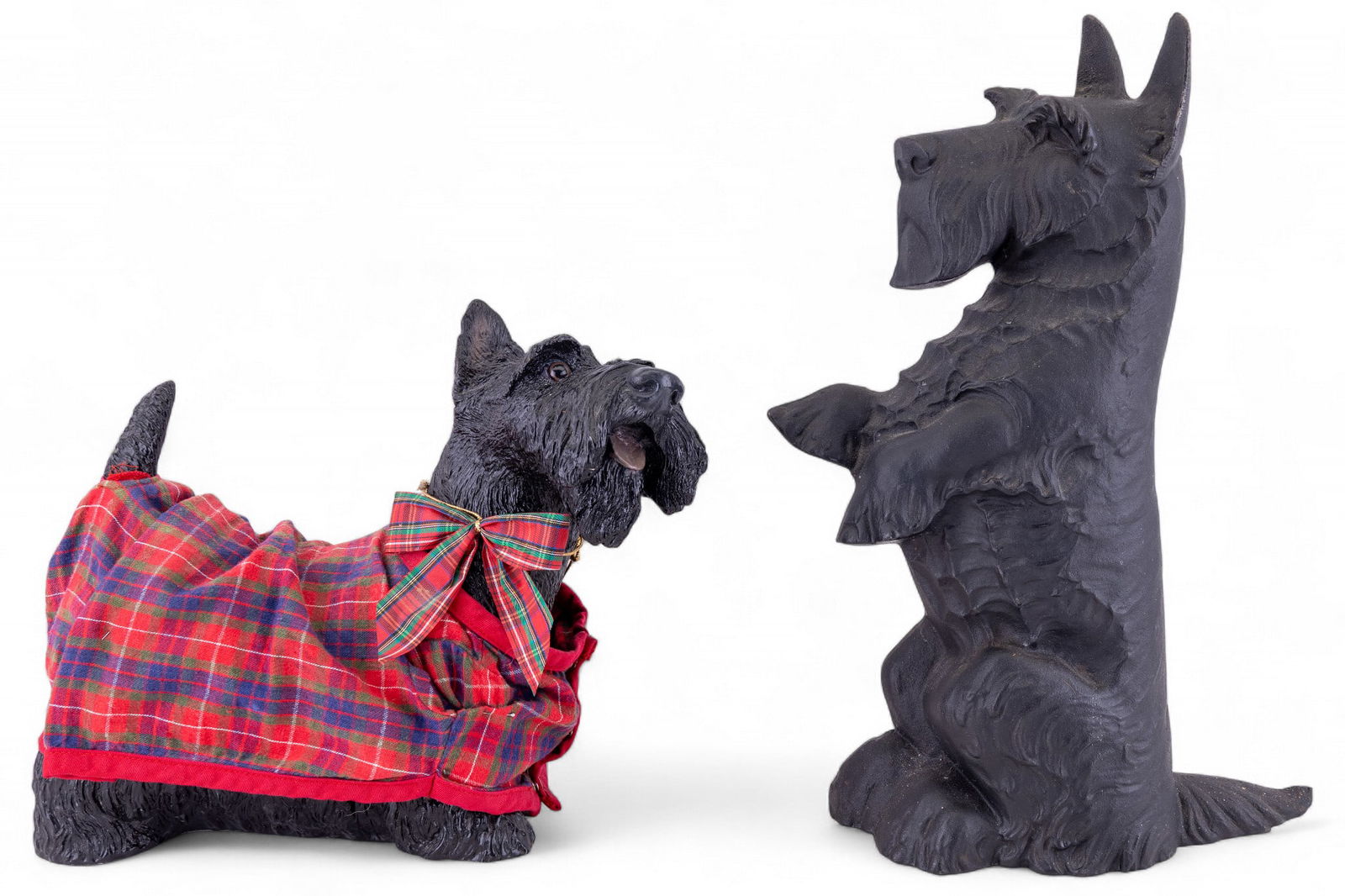 Cast Iron Scottish Terrier Doorstop, Figure: Lot includes a resin Scottish terrier with red flanel attire, along with a cast iron Scottish terrier one-sided doorstop. Doorstop measures approx. 16.5" H.