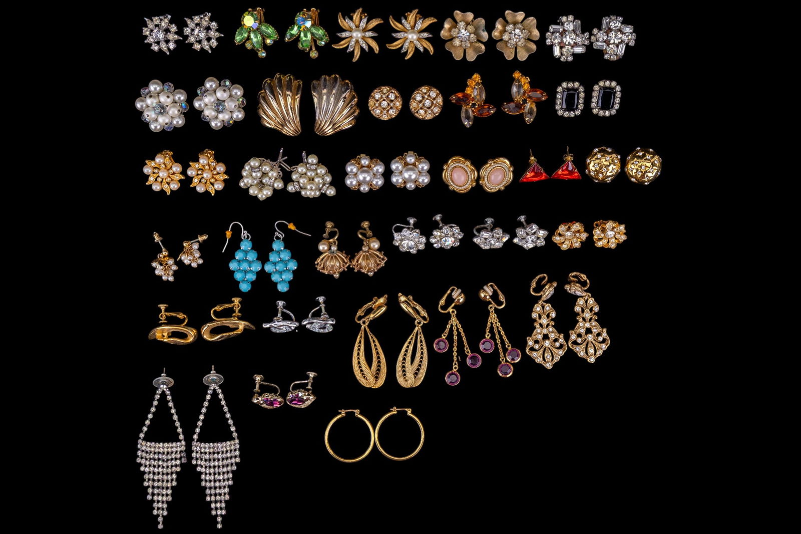 Vintage Designer Brand Earrings: A collection of 30 pairs of vintage designer clip on, piereced, and screw back earrings featuring brands such as Beau Jewels, Coro, Weiss, Bogoff, Lisner, Trifari, Laguna, and Judy Lee.