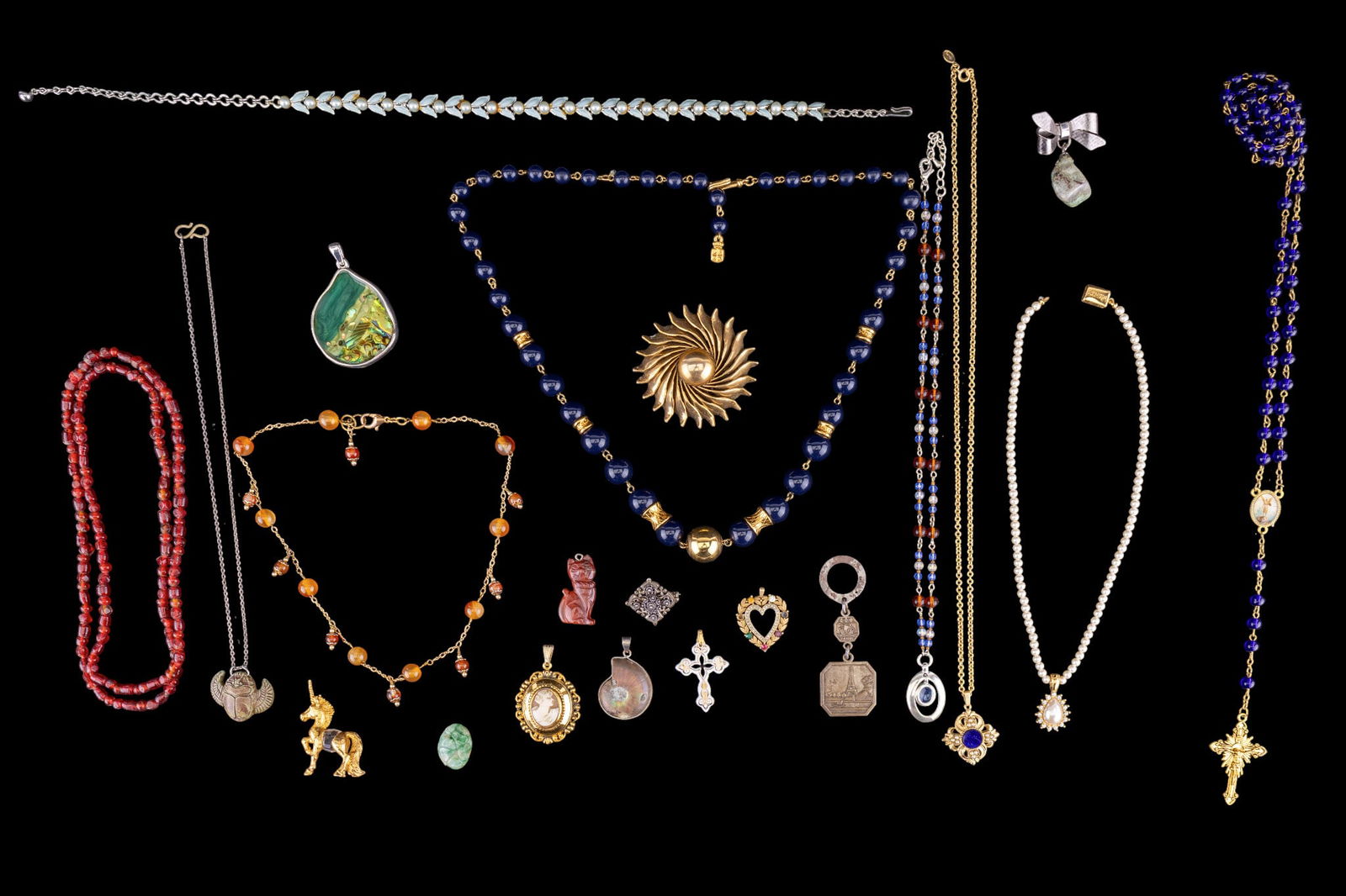 Vintage Jewelry Grouping: Vintage gold-tone and silver-tone jewelry including: enameled faux pearl silver-tone necklace, gold-tone and cobalt blue beaded necklace; cobalt blue beaded roseary; fossil pendant with silver-tone fr