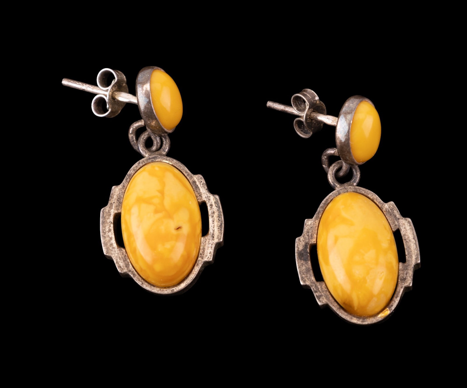 Amber and Sterling: Vintage yellow amber pierced drop earrings set in sterling silver.