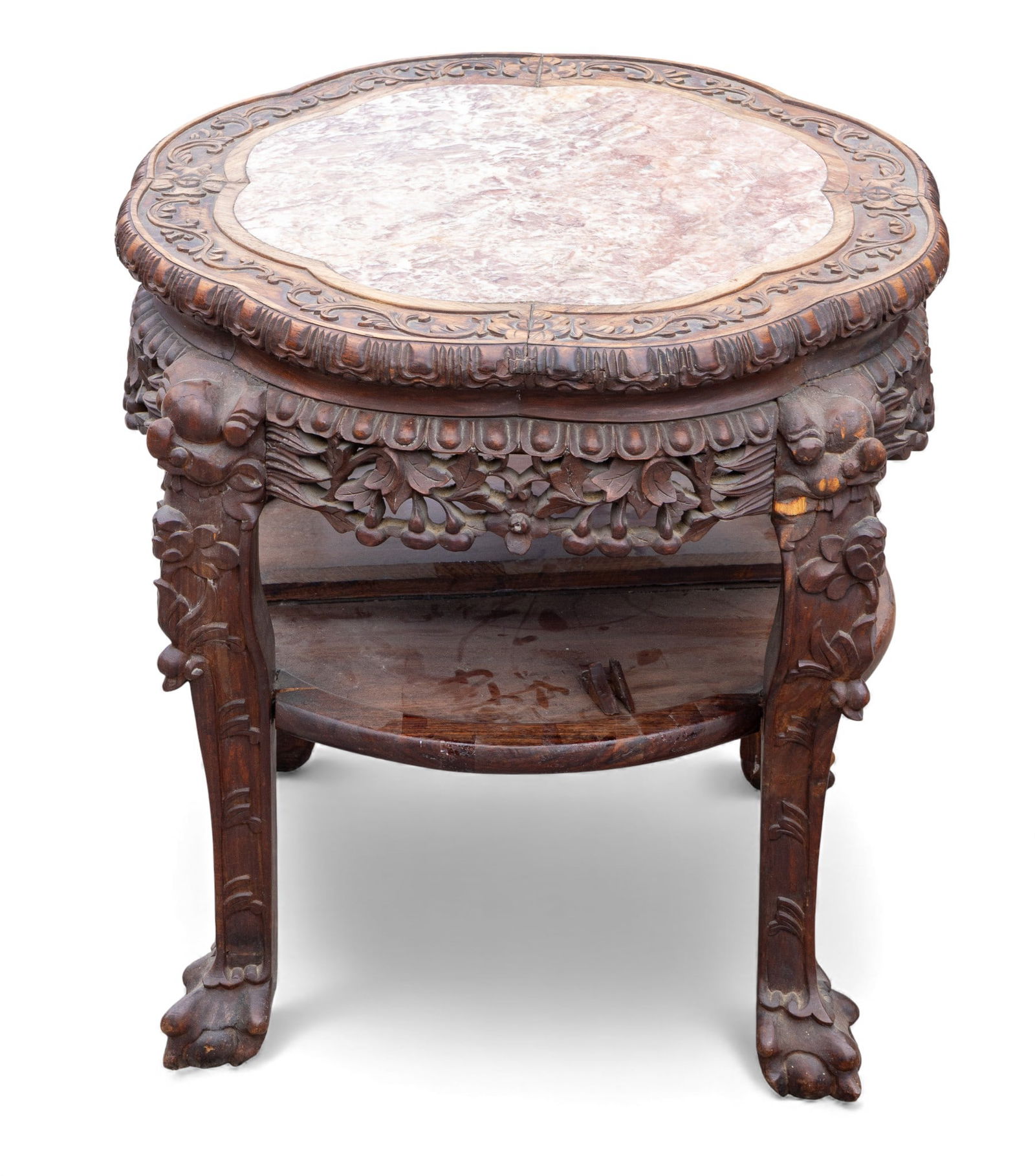 19th C Chinese Hardwood Marble Top Table: 19th Century Chinese carved hardwood marble top table with ball and claw feet, and floral border carving up top around marble. Bottom shelf has rim piece detached as seen in photography. Measures appr