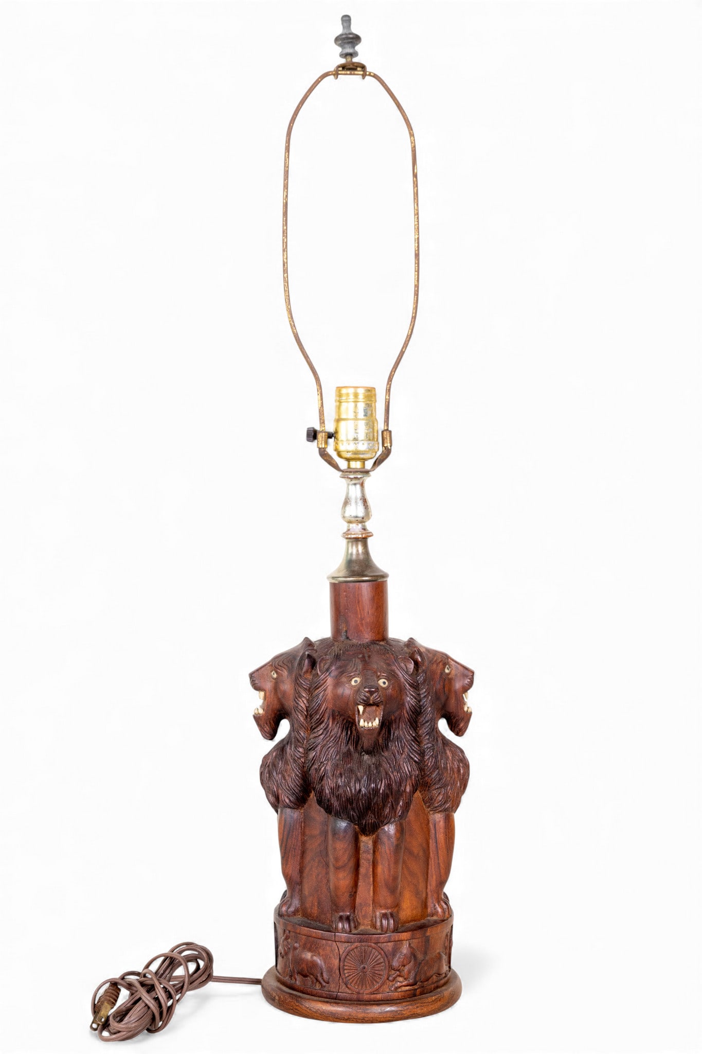 Finely Carved Exotic Wood Lion Lamp: Finely Carved Exotic Wood Lion Lamp with inset eyes and teeth. Measures approx 29.5' to the top of the harp and 12.5" to the top of the wood lamp base.